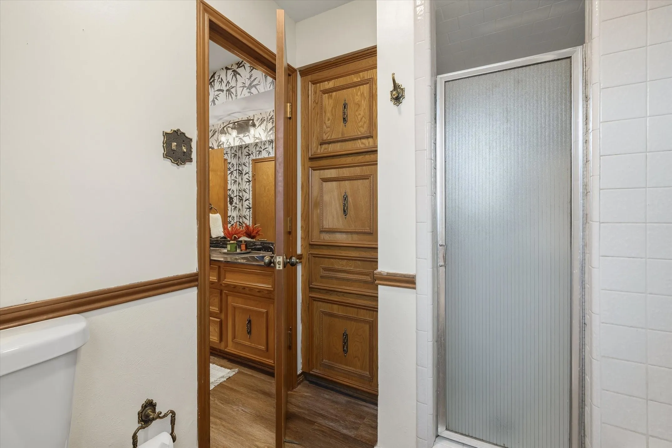 The primary bath features a separate walk-in shower in addition to a shower/tub combination.