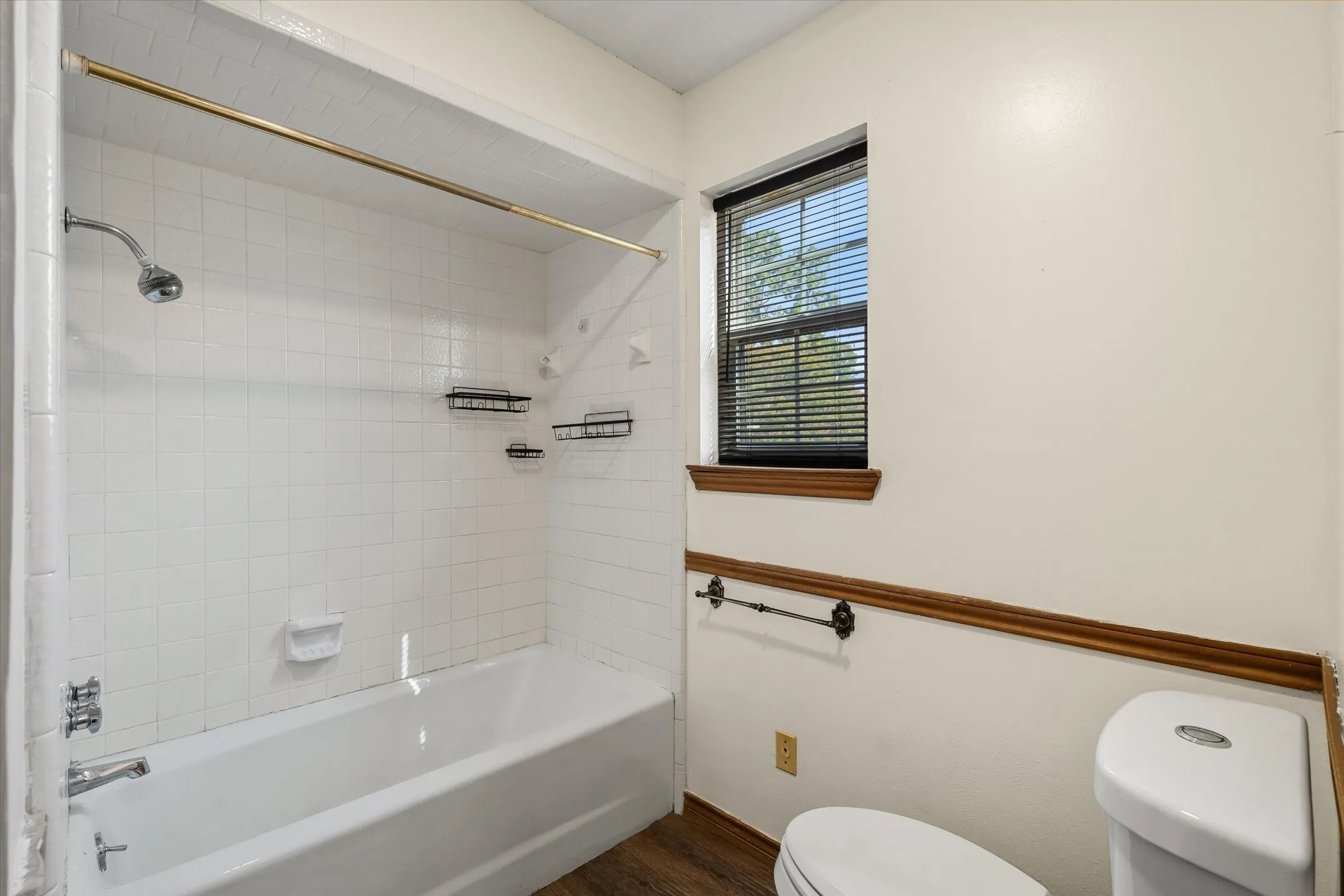 The primary bath features a tub shower combination AND a separate walk-in shower.