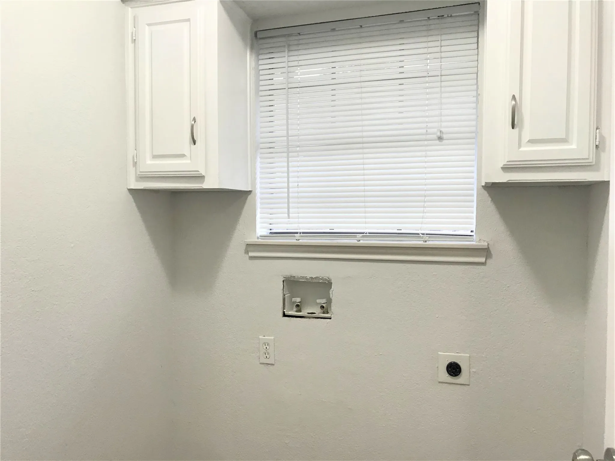 Utility room is off the kitchen and the 2 car garage