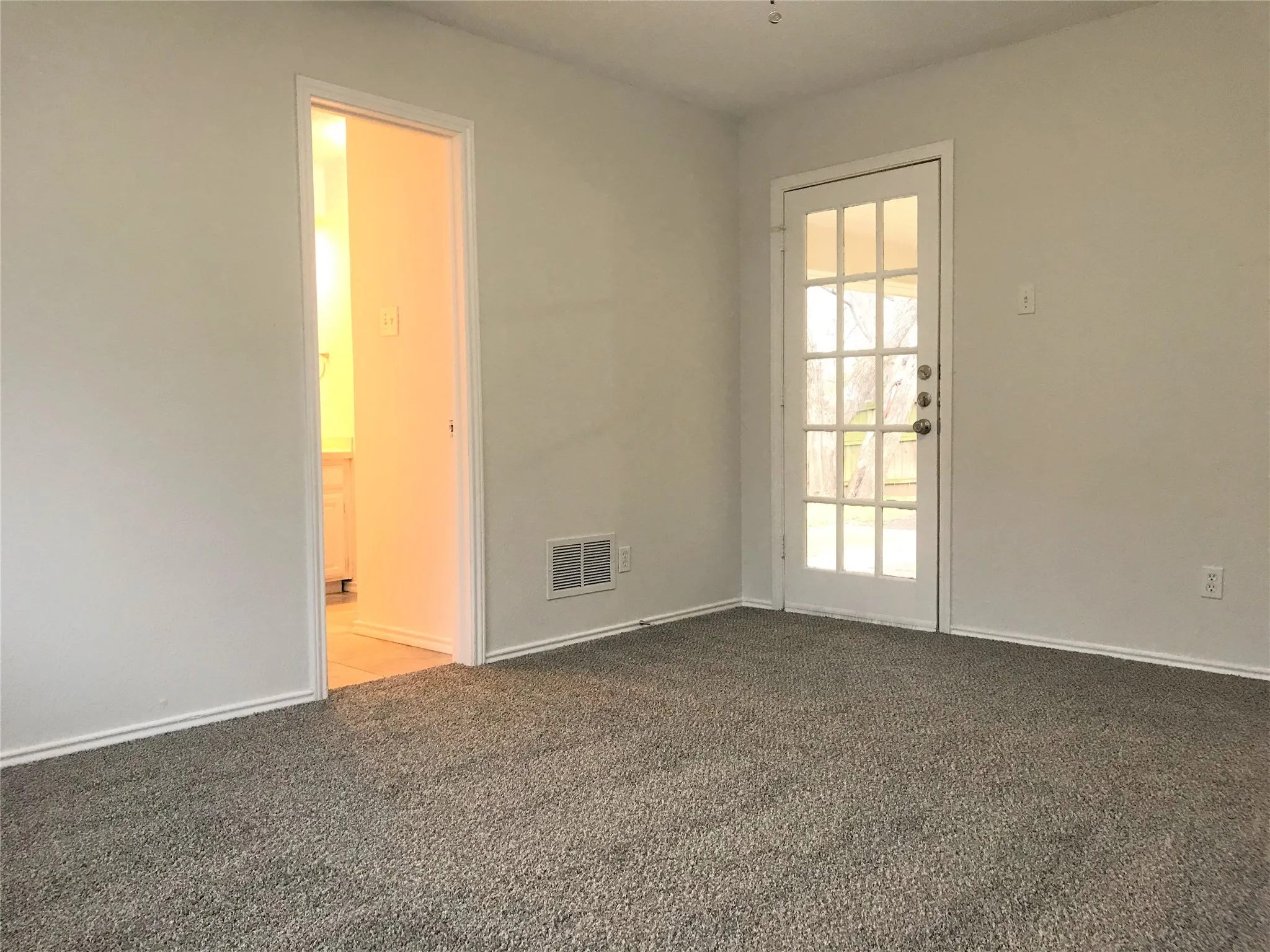 Master bedroom has access to the back patio