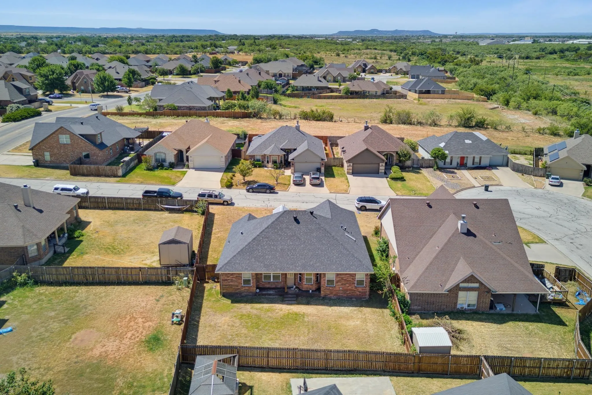 Expansive residential neighborhood with mature landscaping and well-maintained properties