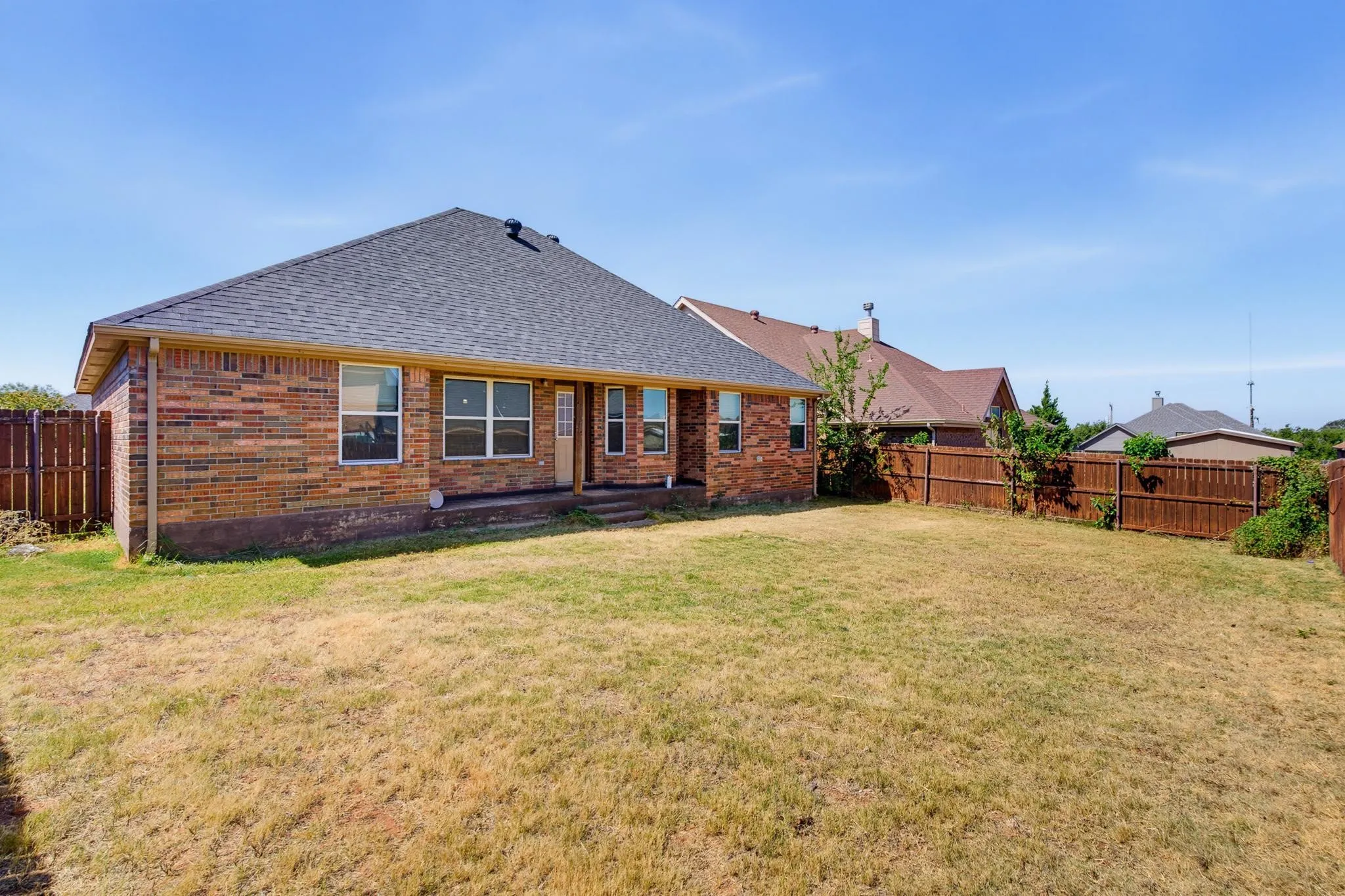 Brick exterior with an asphalt shingle roof