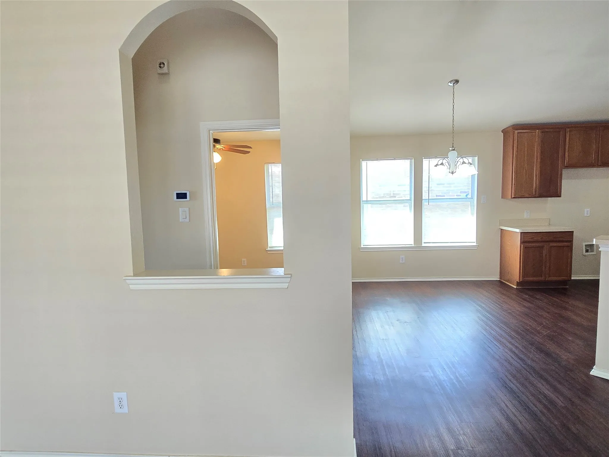 Decorative arch separating the primary hall from the living room--the perfect spot for your own decor!