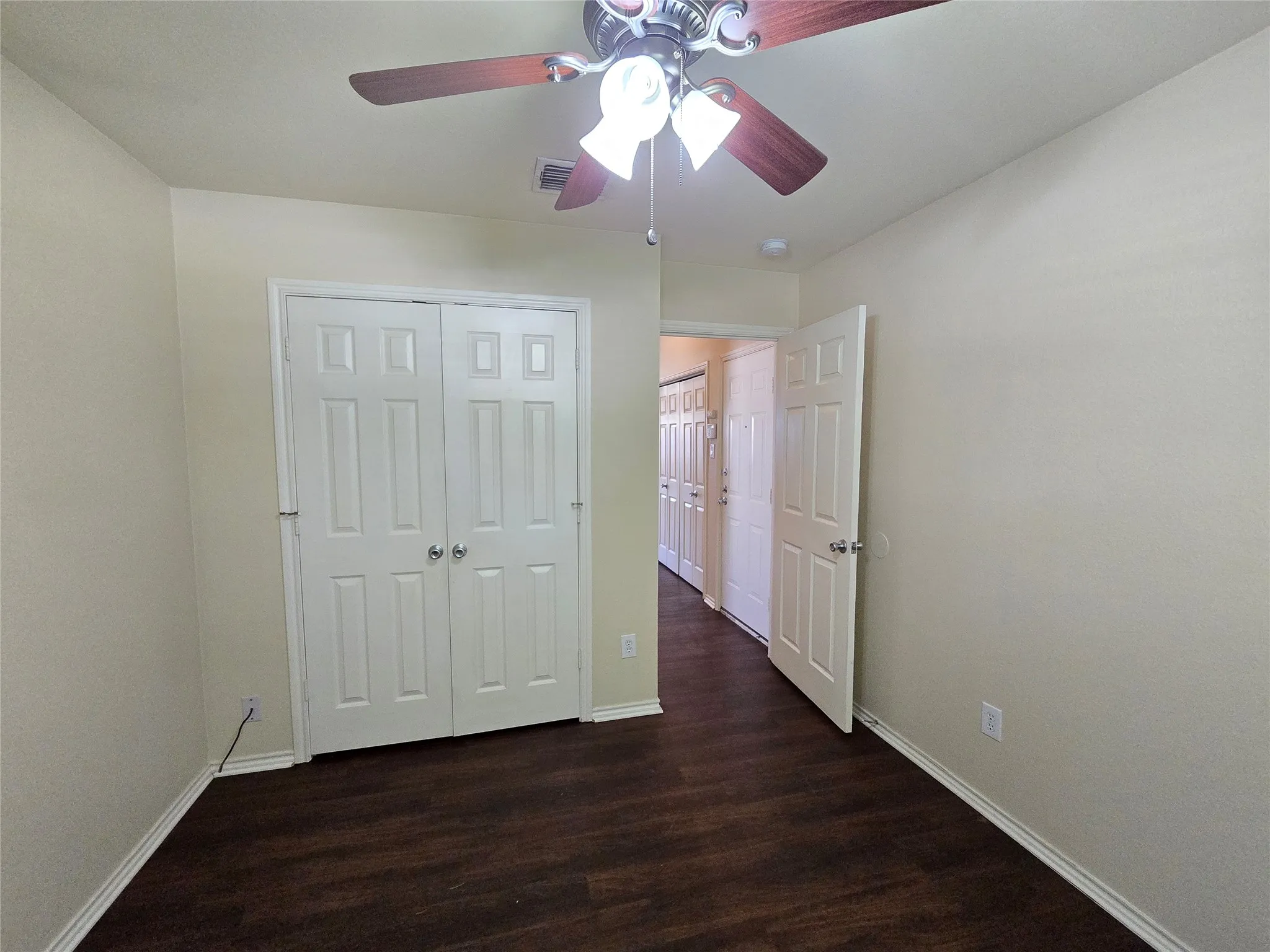 Bedroom 3 in front of home near hall bathroom and garage entry.