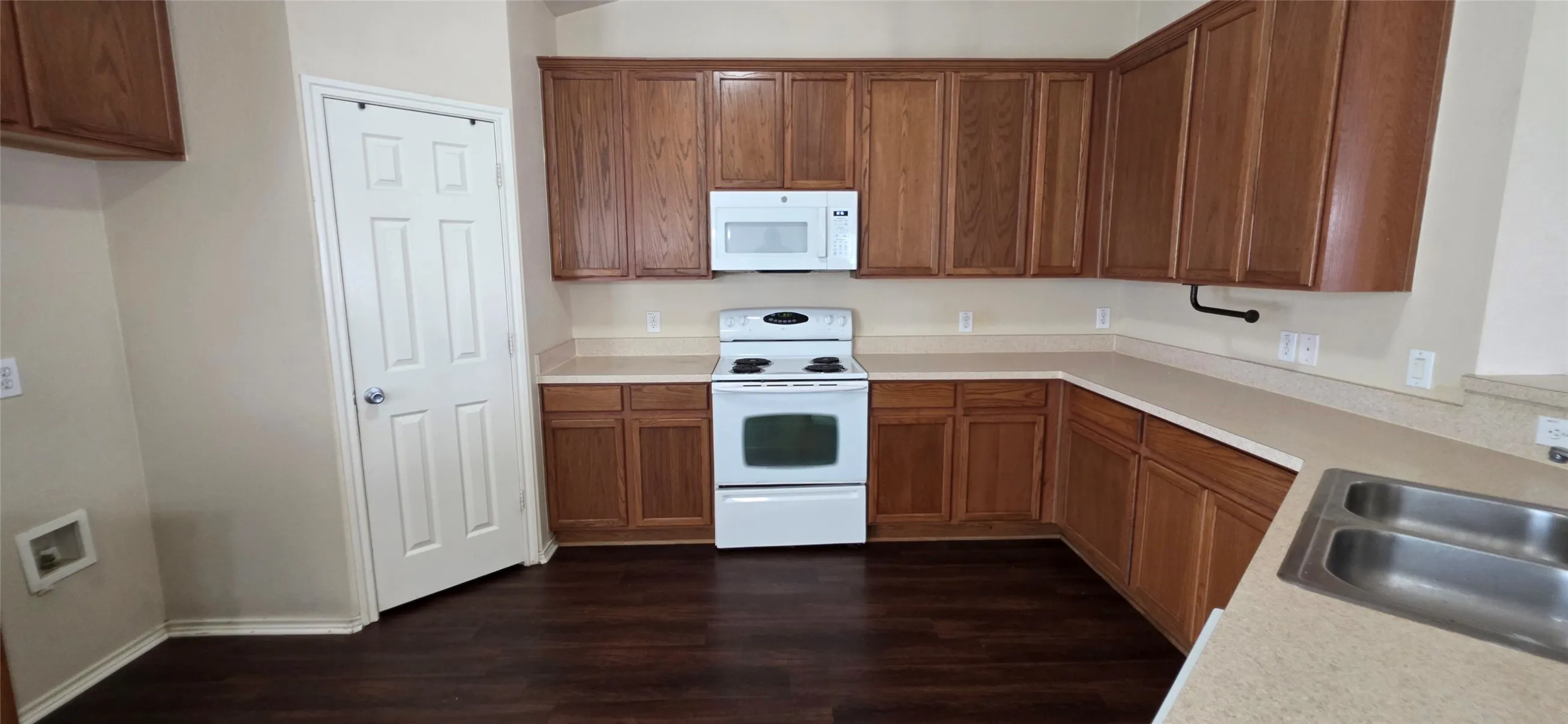 Plenty of counter space in this kitchen. Electric range, built-in microwave, dishwasher and disposal are included!