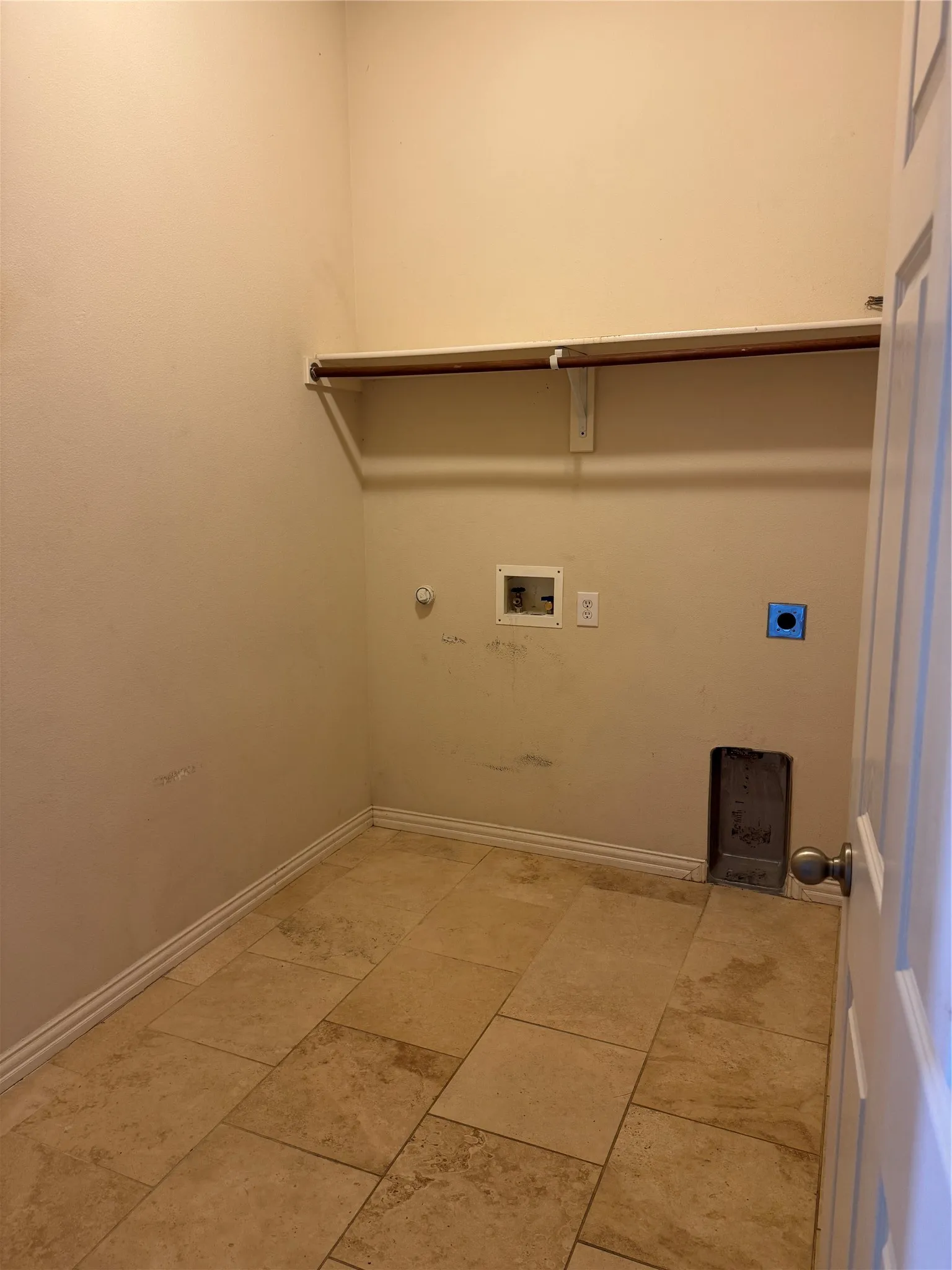 Laundry area featuring laundry area, electric dryer hookup, washer hookup,  and baseboards