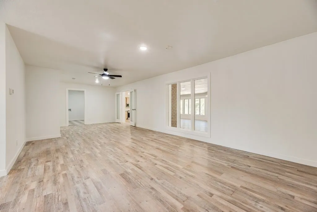 First living area in the home that leads to laundry and kitchen.