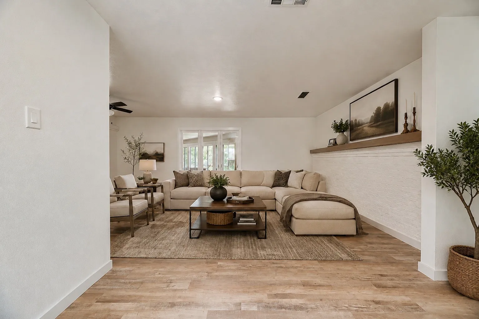 This is one of the two living spaces within this home. Separated by glass windows.