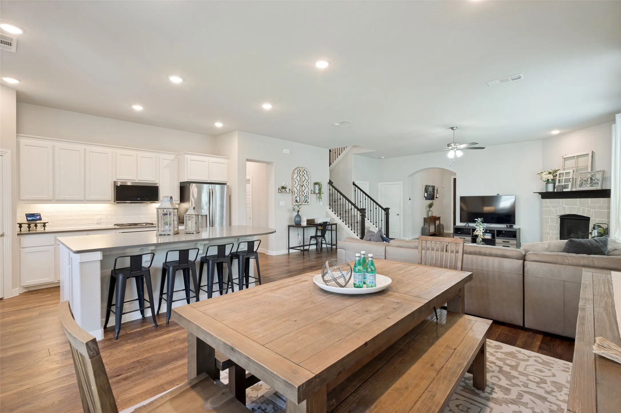 The bright, open-concept kitchen, living and dining area is designed for comfortable everyday living and easy entertaining.