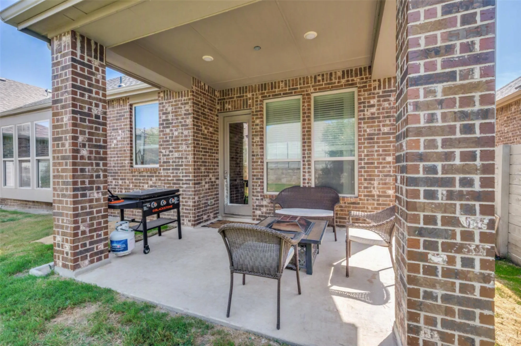 Outside is a covered patio overlooking the spacious back yard.