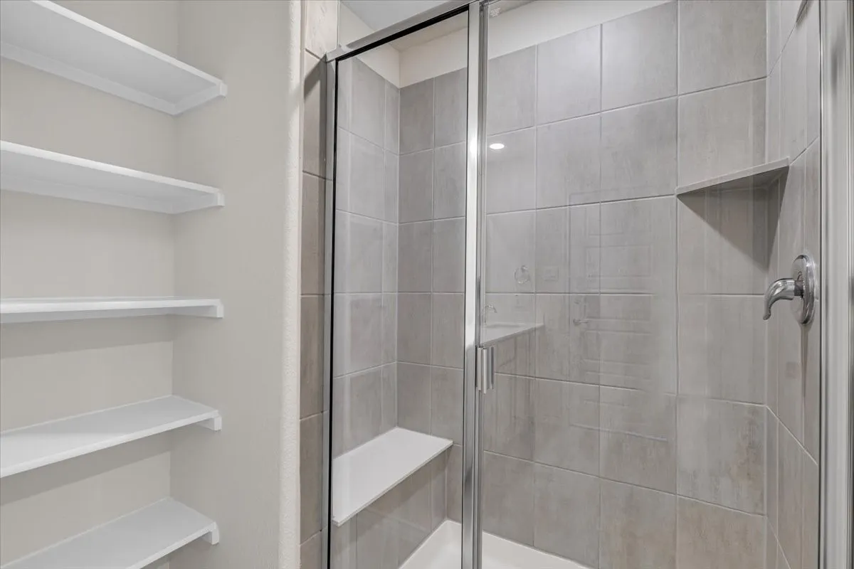Fantastic master bath with large shower with bench