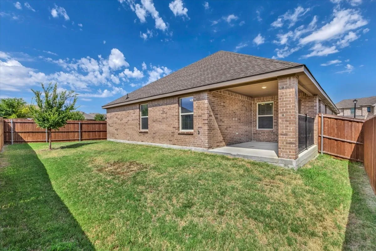Large backyard with covered patio