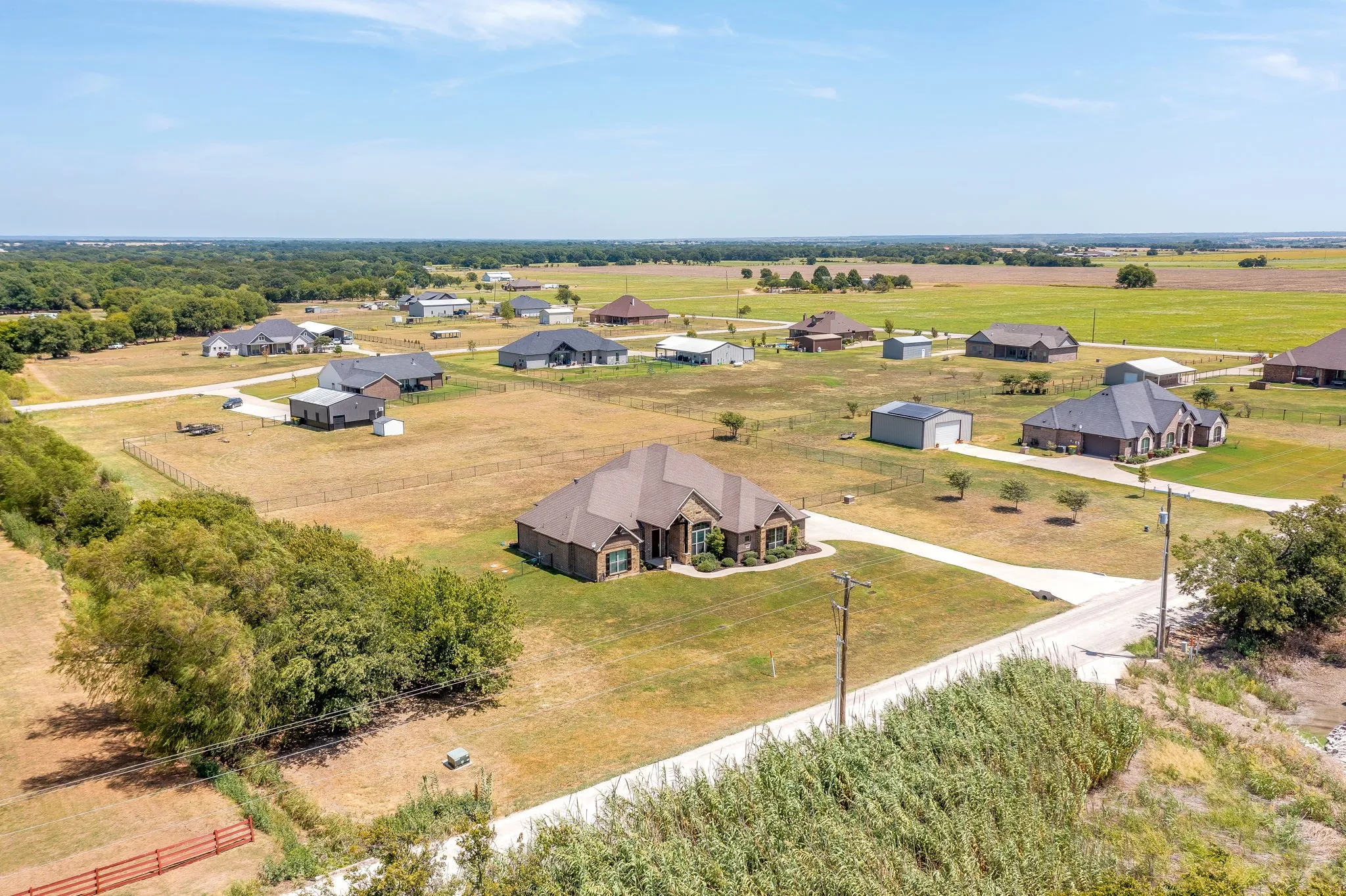 Spacious property with a large, private driveway and manicured front landscaping