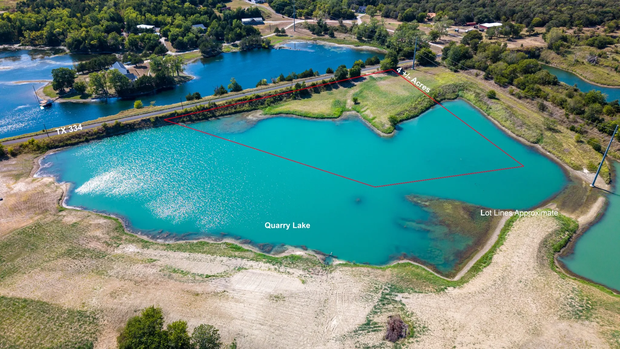 Expansive 1.46-acre lot featuring waterfront access to Quarry Lake