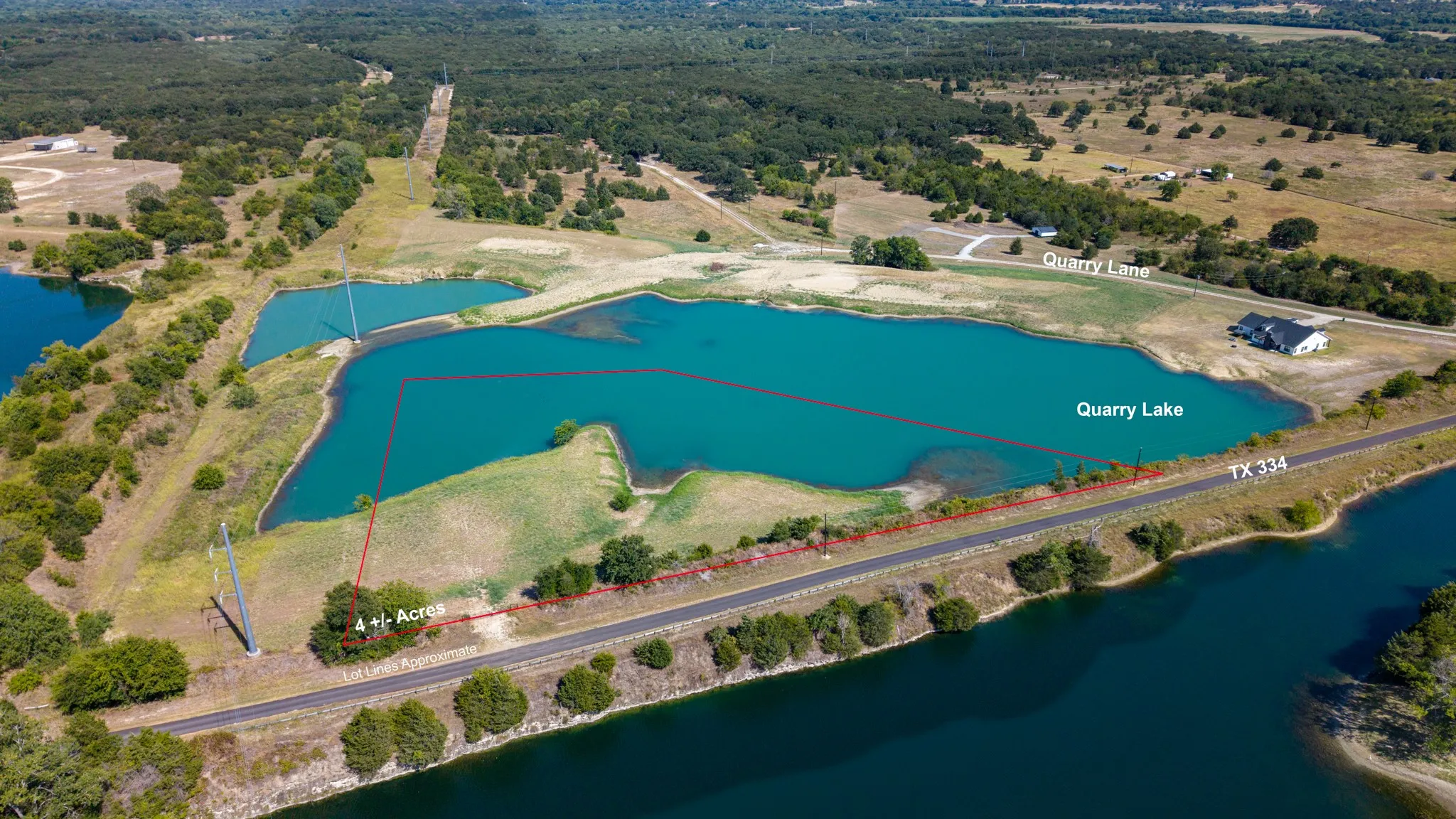 Expansive land parcel featuring direct road frontage, serene water frontage, and surrounding mature trees