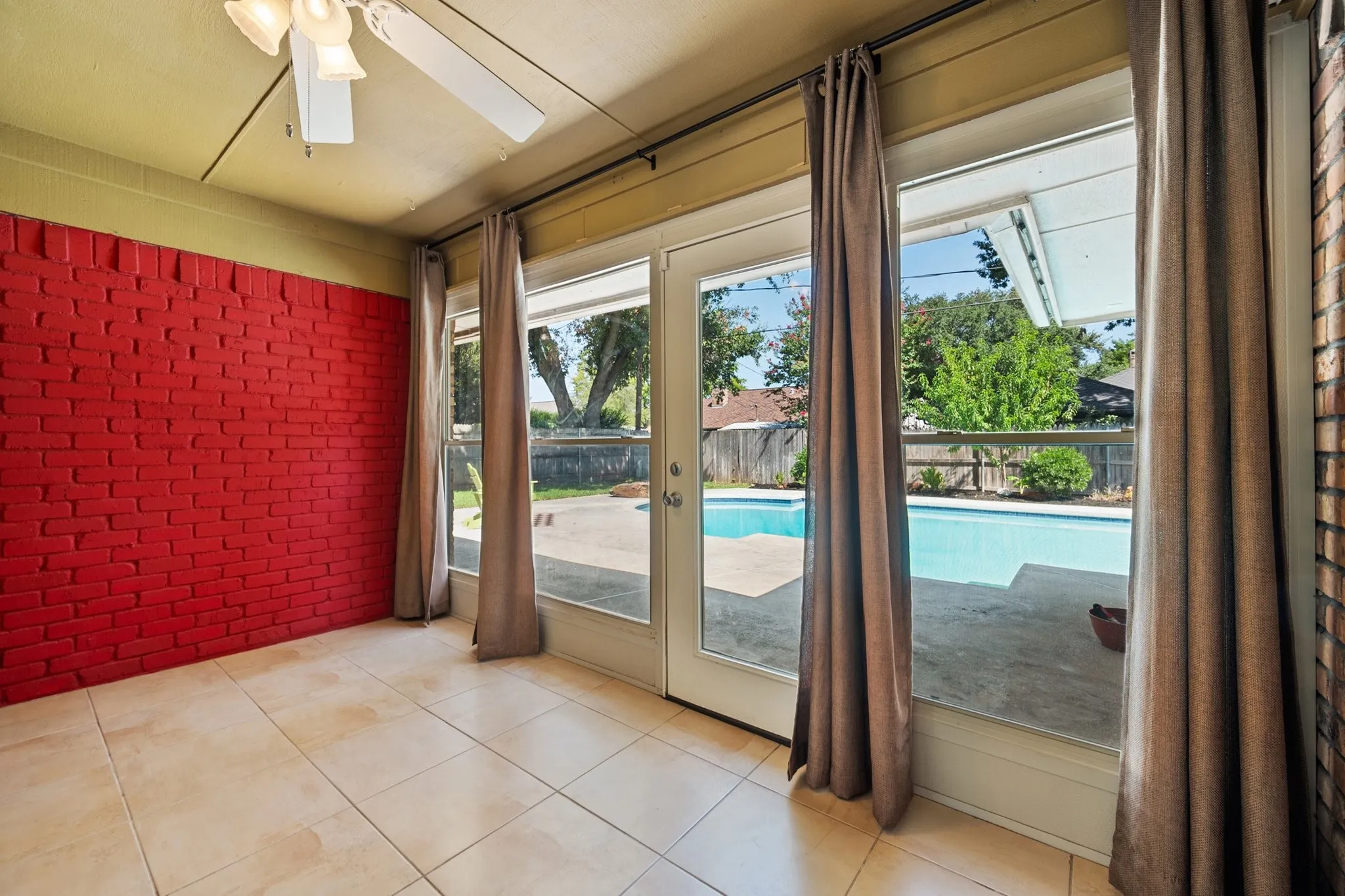 This bonus sunroom adds valuable flexible living space with large windows and a direct view of the backyard pool—ideal for a lounge, playroom, hobby space, or home office.