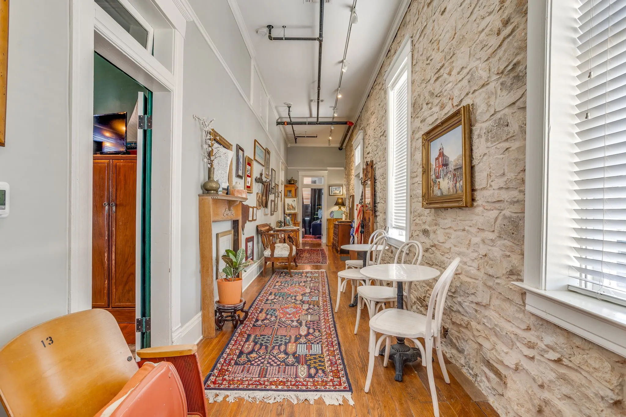 This galley welcome area features two, cozy bistro tables and chairs and also has a breakfast nook.