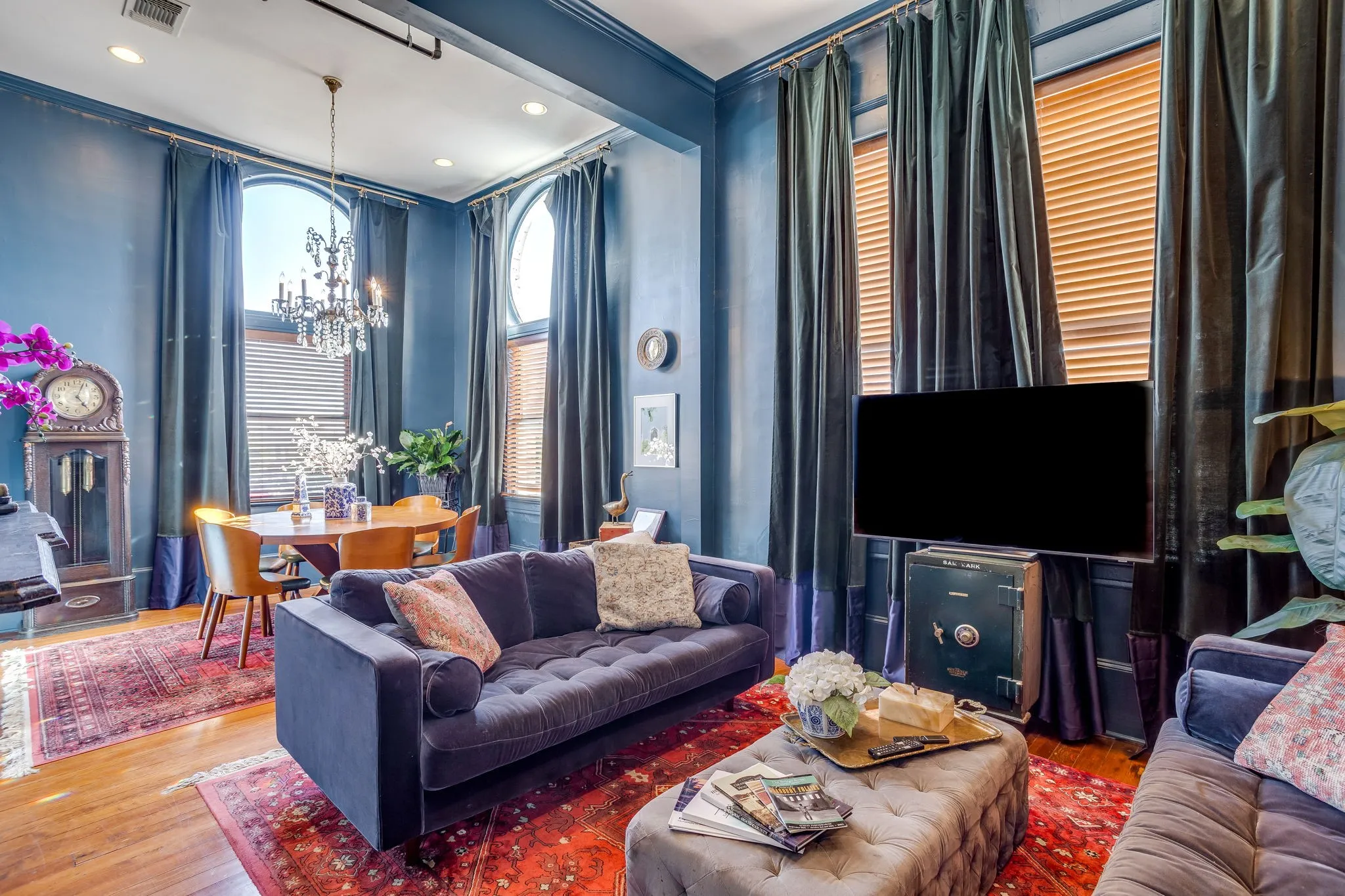 The upstairs short-term-rental space is luxurious and bougie. Enjoy the views of the Square in this stylish space.