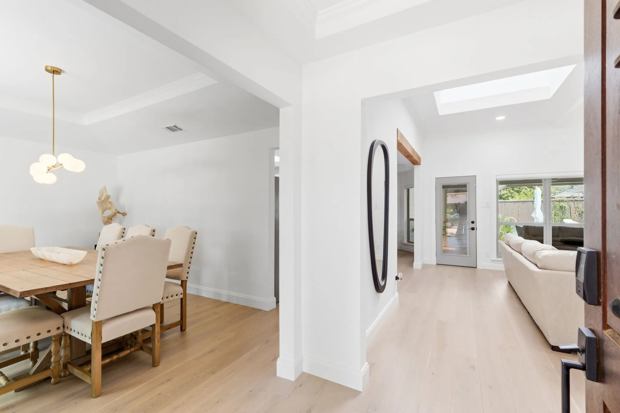 Entry way with vantage points of the dining room and living room