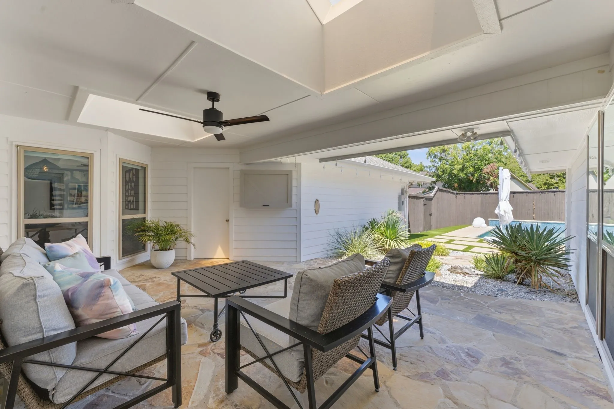 The front yard still offers traditional landscaping and inviting curb appeal.