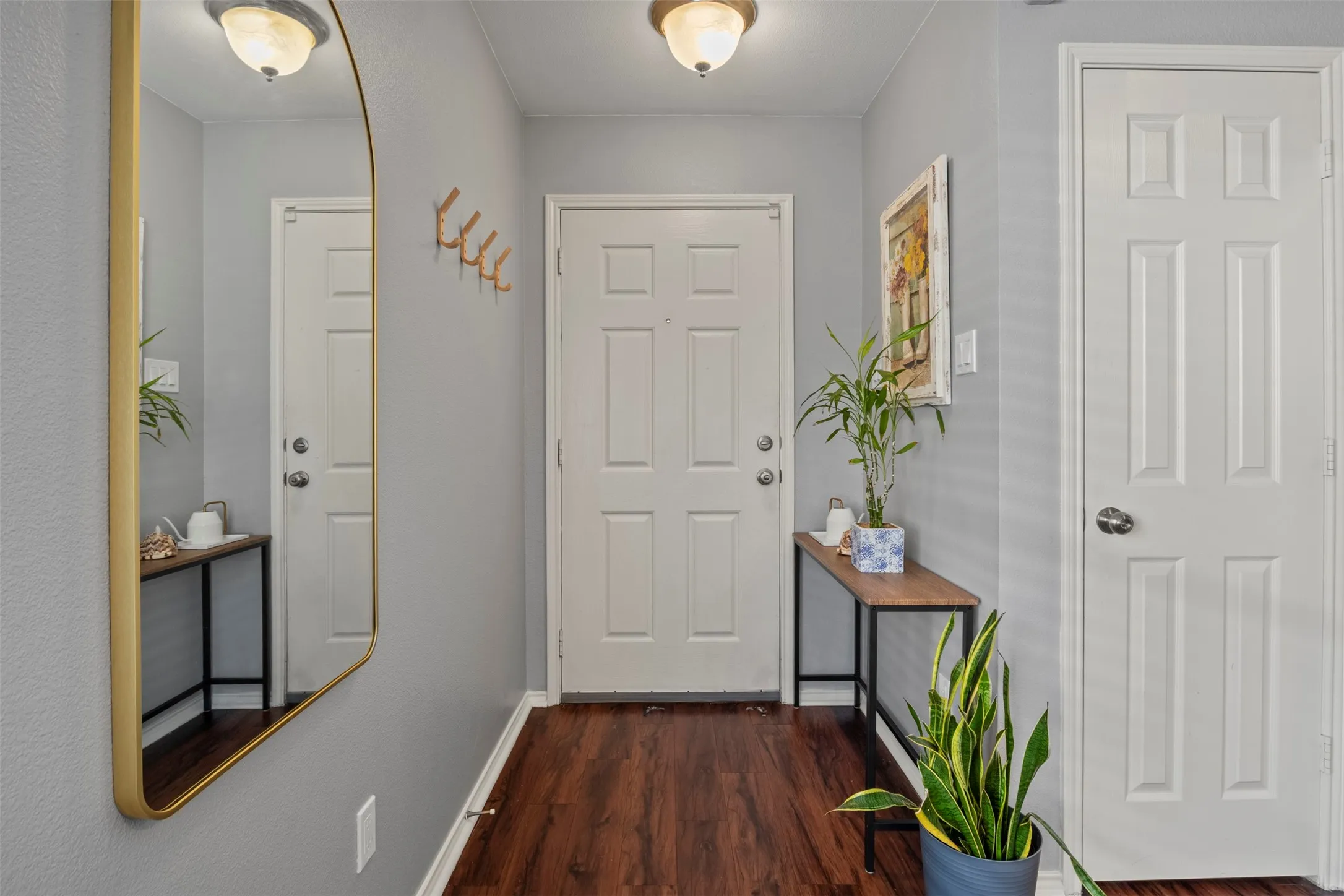 Wood-finish flooring with a light gray wall color