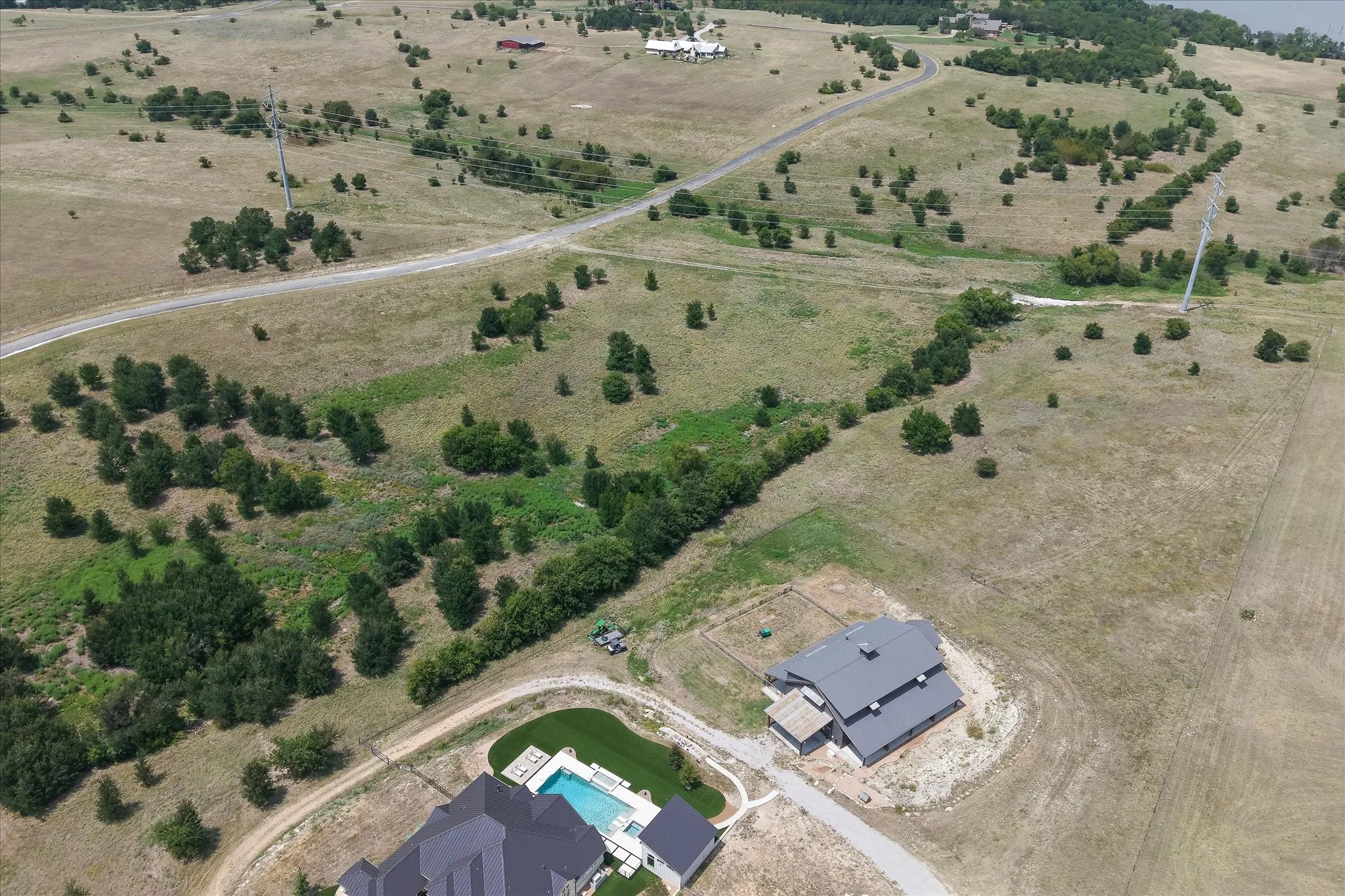 View of the unimproved land adjacent to 11.6 acre home site property also offered for sale.