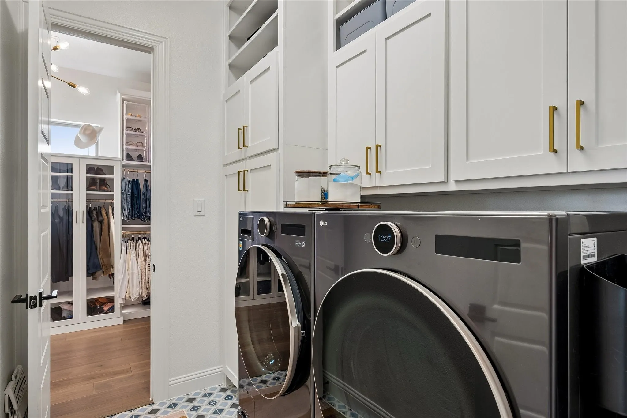 So handy to have laundry room adjoining your closet with room for large washer and dryer. The closet next to the washing machine has a built in plug to hang and charge a cordless vacuum cleaner.