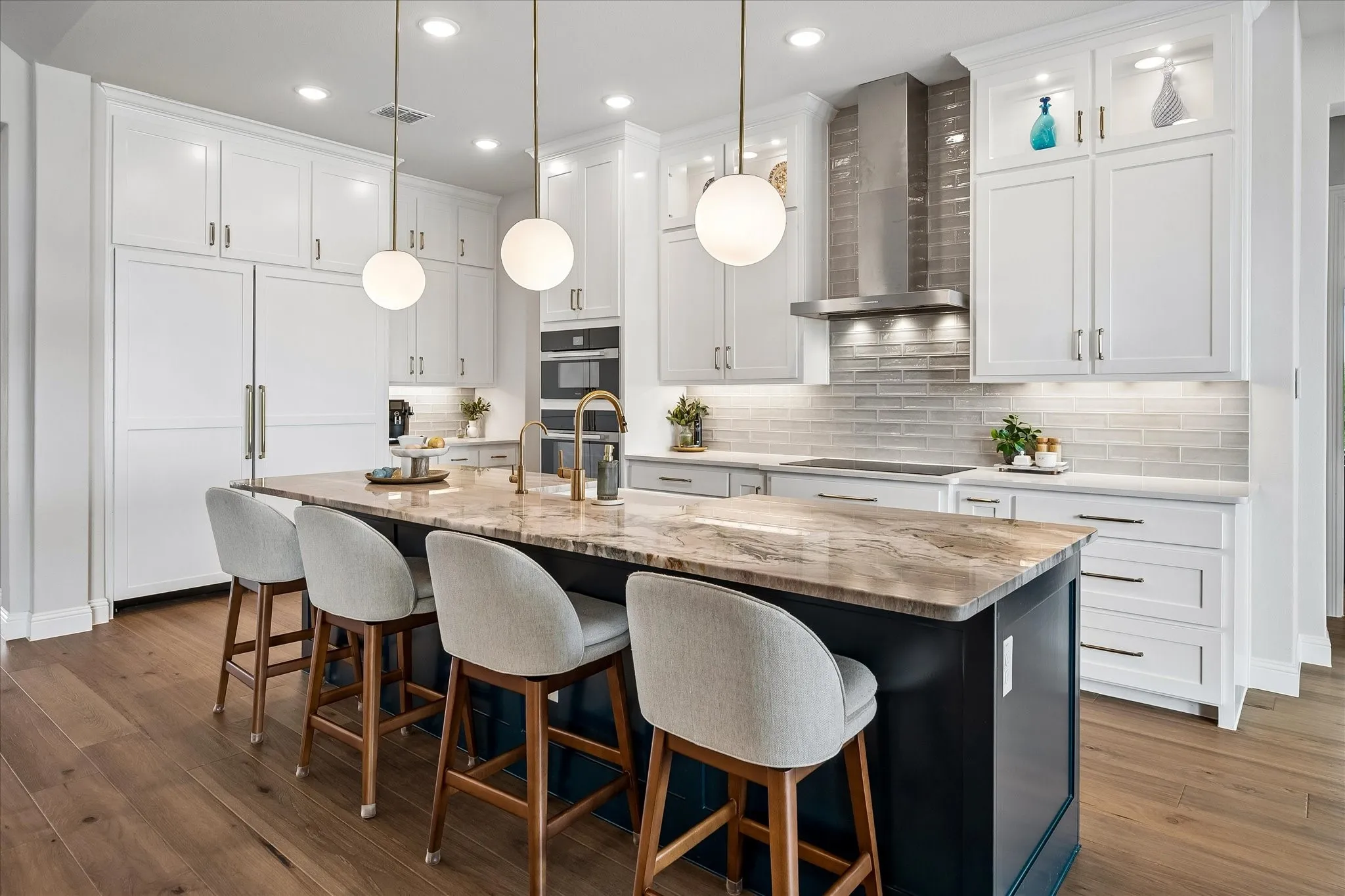 Floor to ceiling cabinets and large Quantize center island. What you can't clearly see are the hidden outlets.