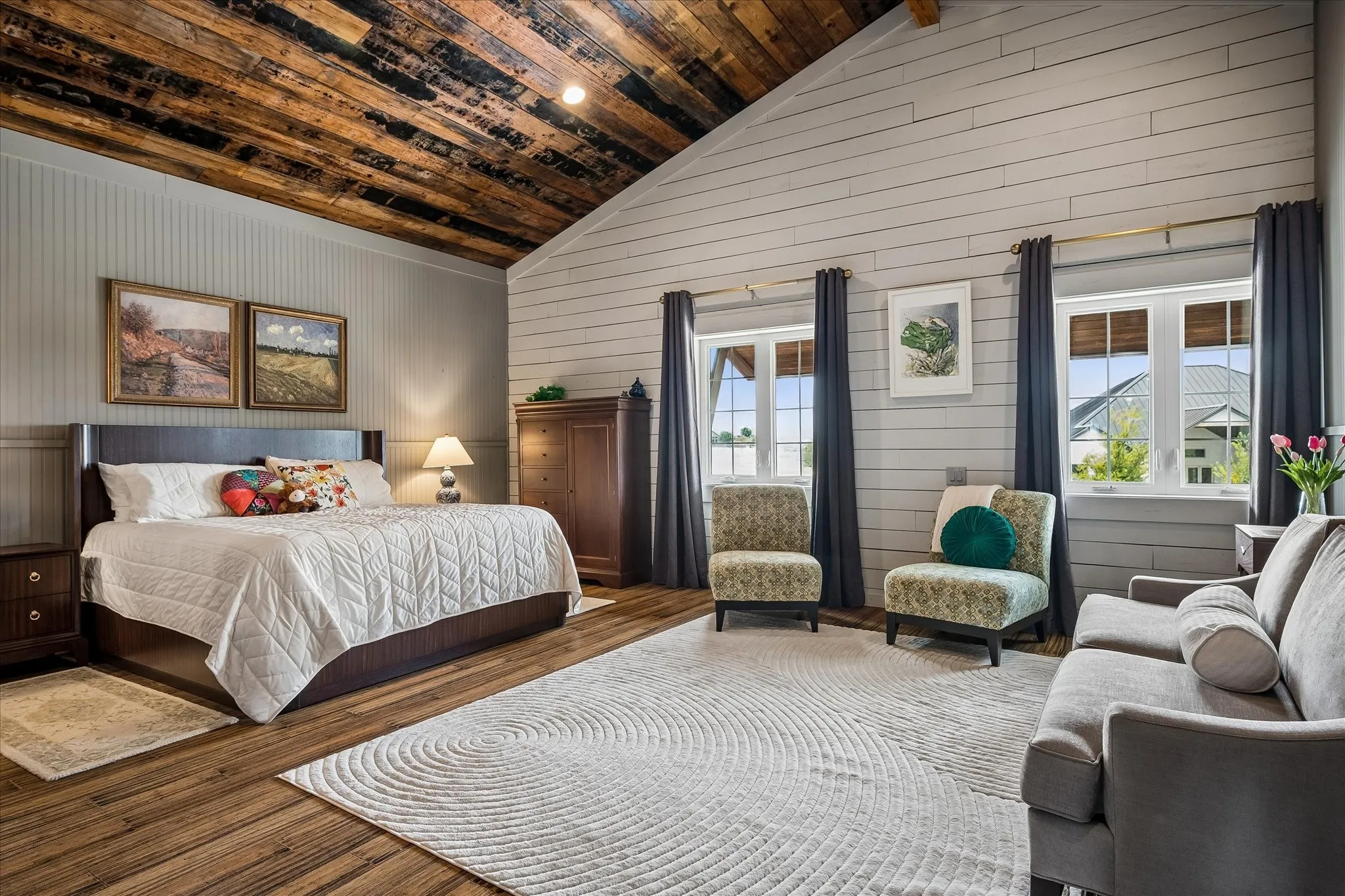 Vaulted ceiling with reclaimed wood, walk in closet, ensuite bath and sitting area.