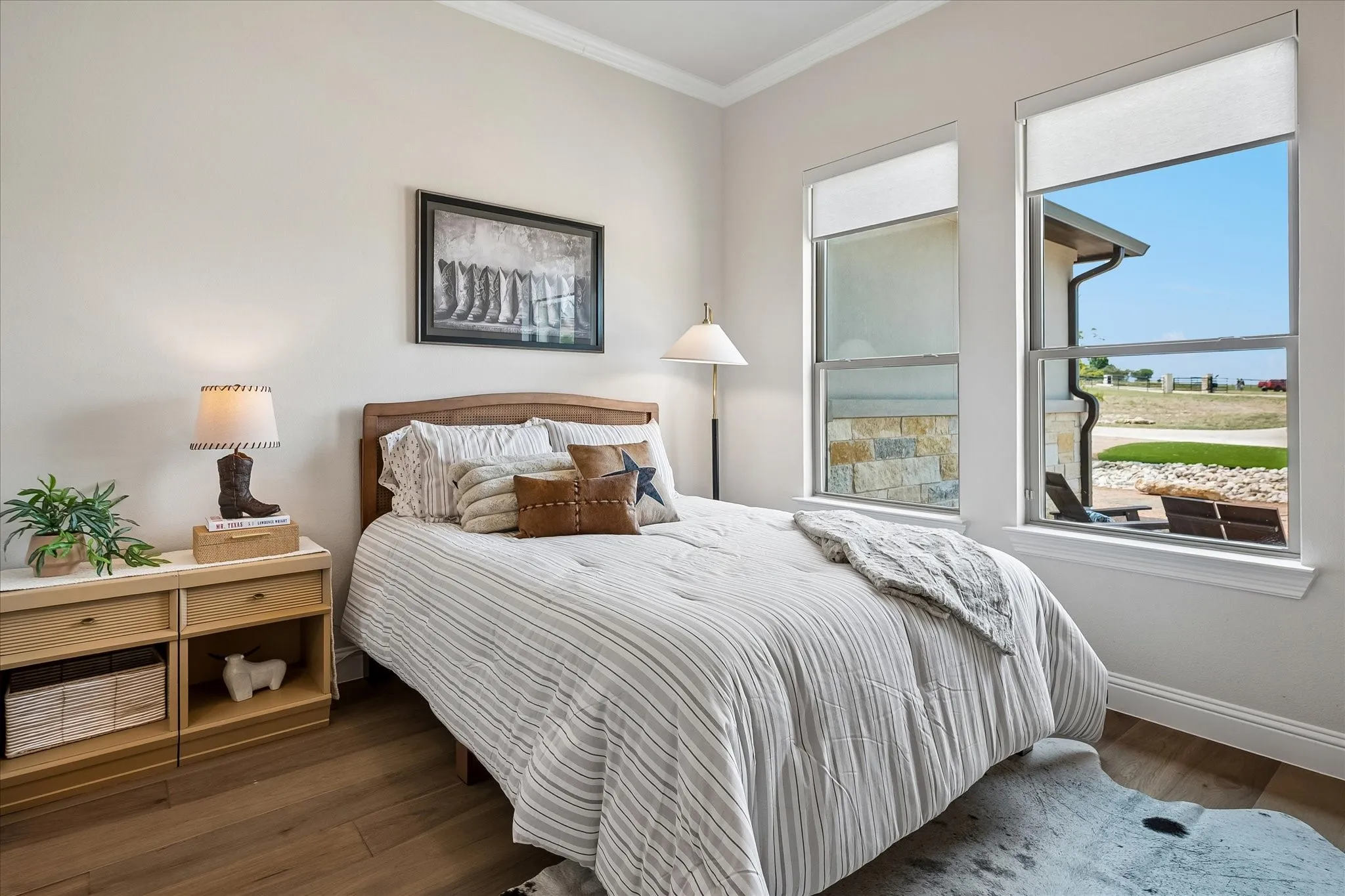 En-suite bedroom with electric shades and walk-in closet.