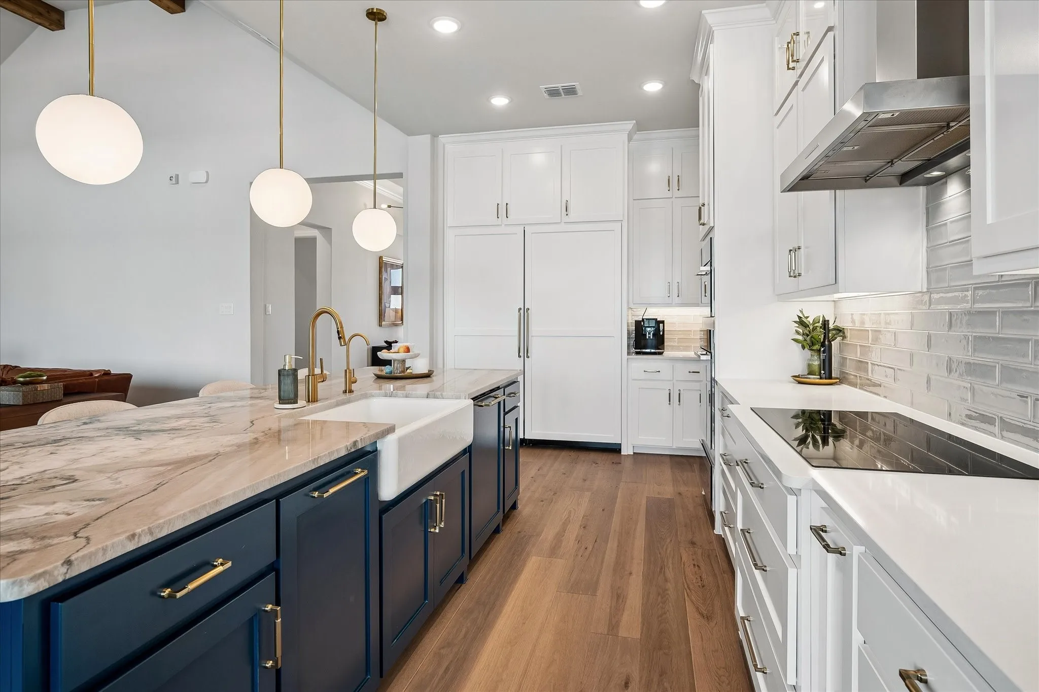 Miele appliances including panel front dishwasher, extended panel front fridge and freezer, vent hood and induction cooktop. All Miele!
