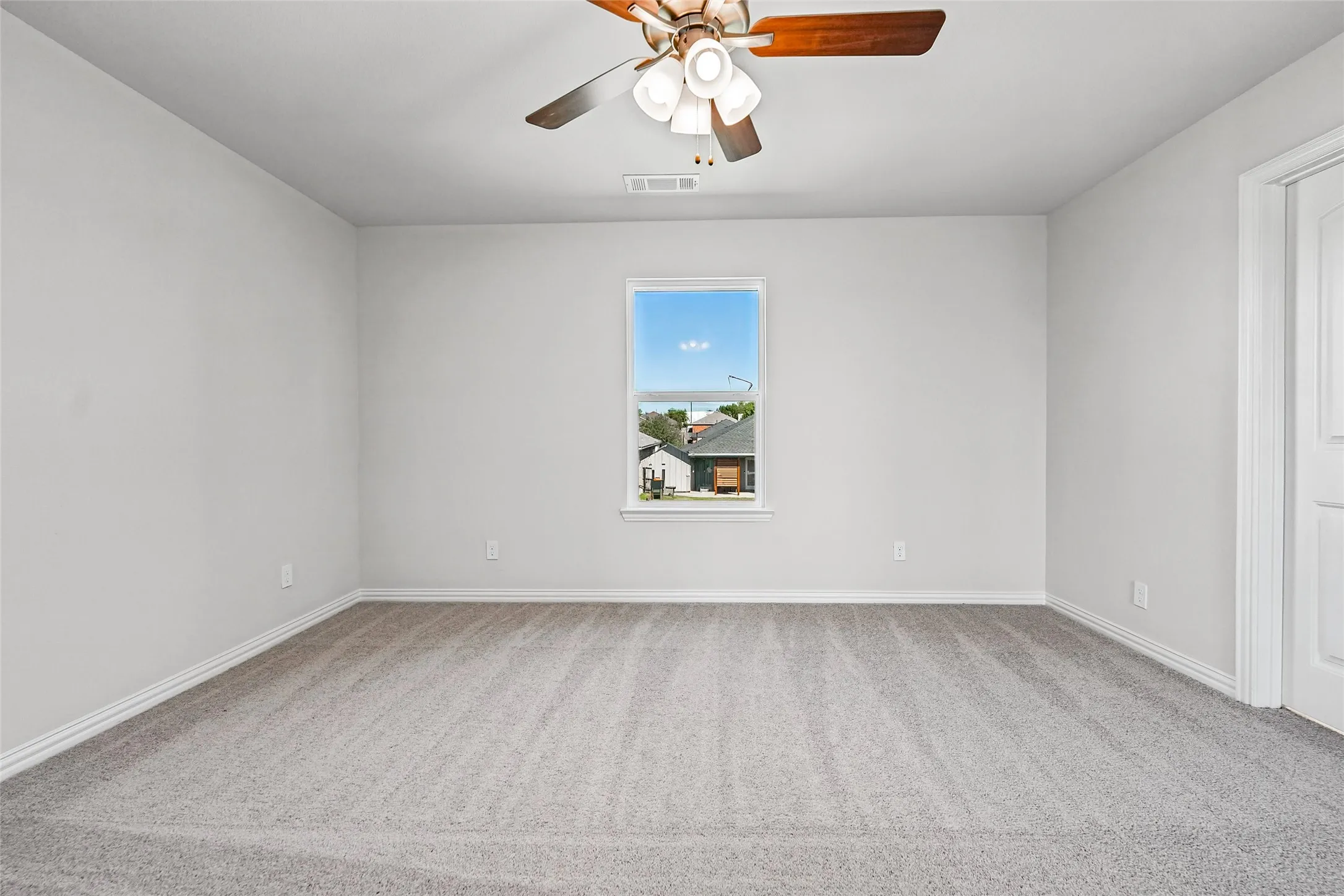 Textured gray carpeting with white trim