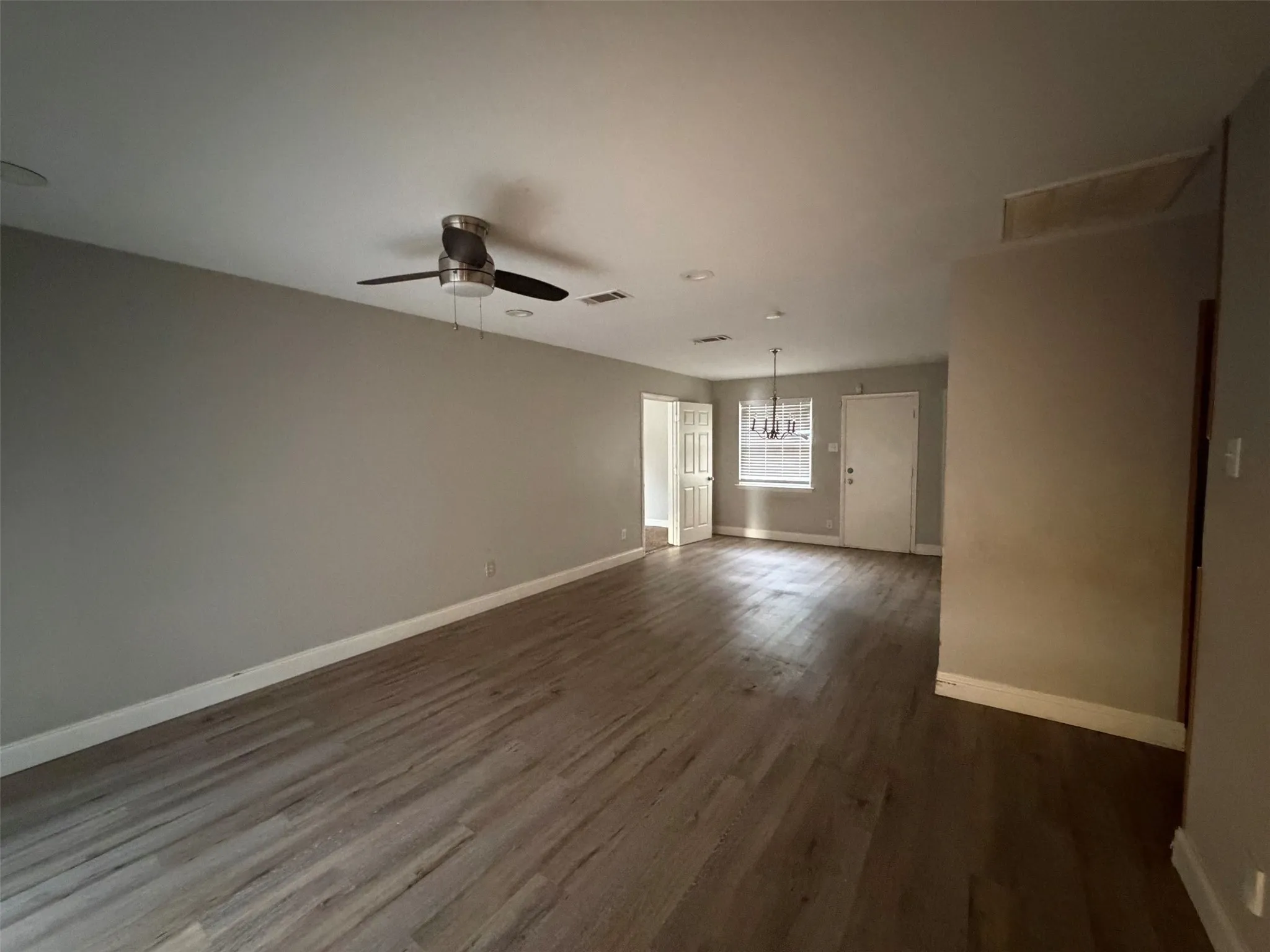 Reverse of living room open with dining room