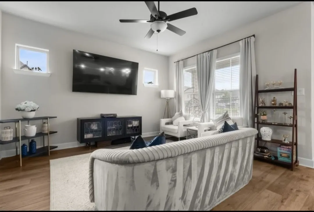 Wood-finish flooring, recessed lighting, and a ceiling fan