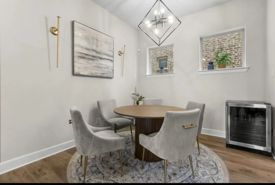 Wood-finish flooring with white baseboards
