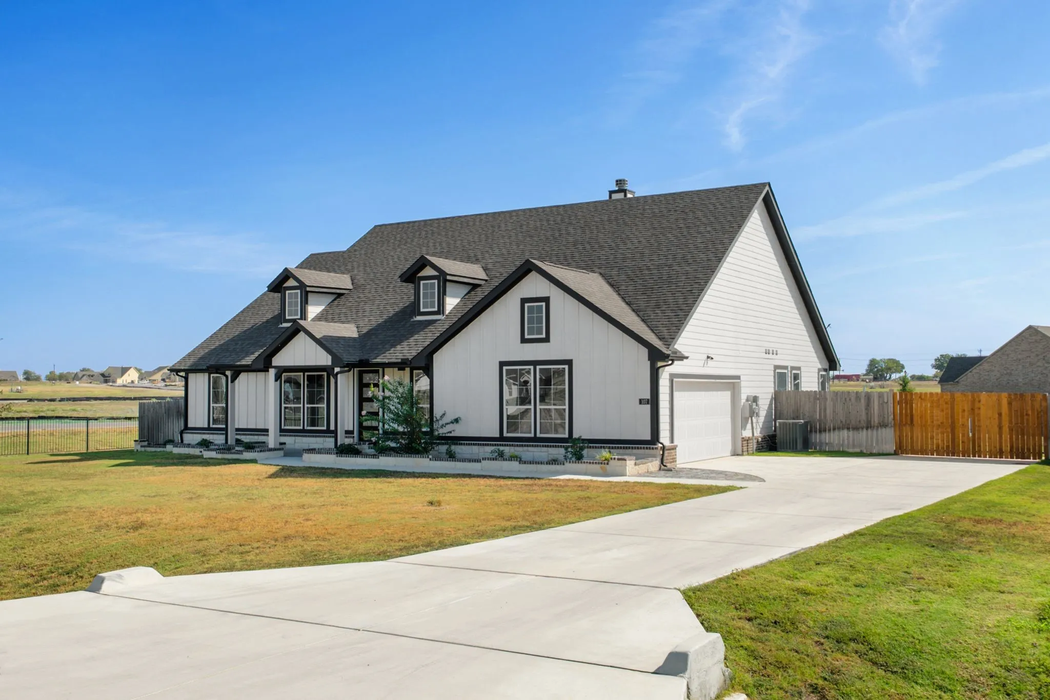 Side garage entry with plenty of space to back large vehicles with ease.