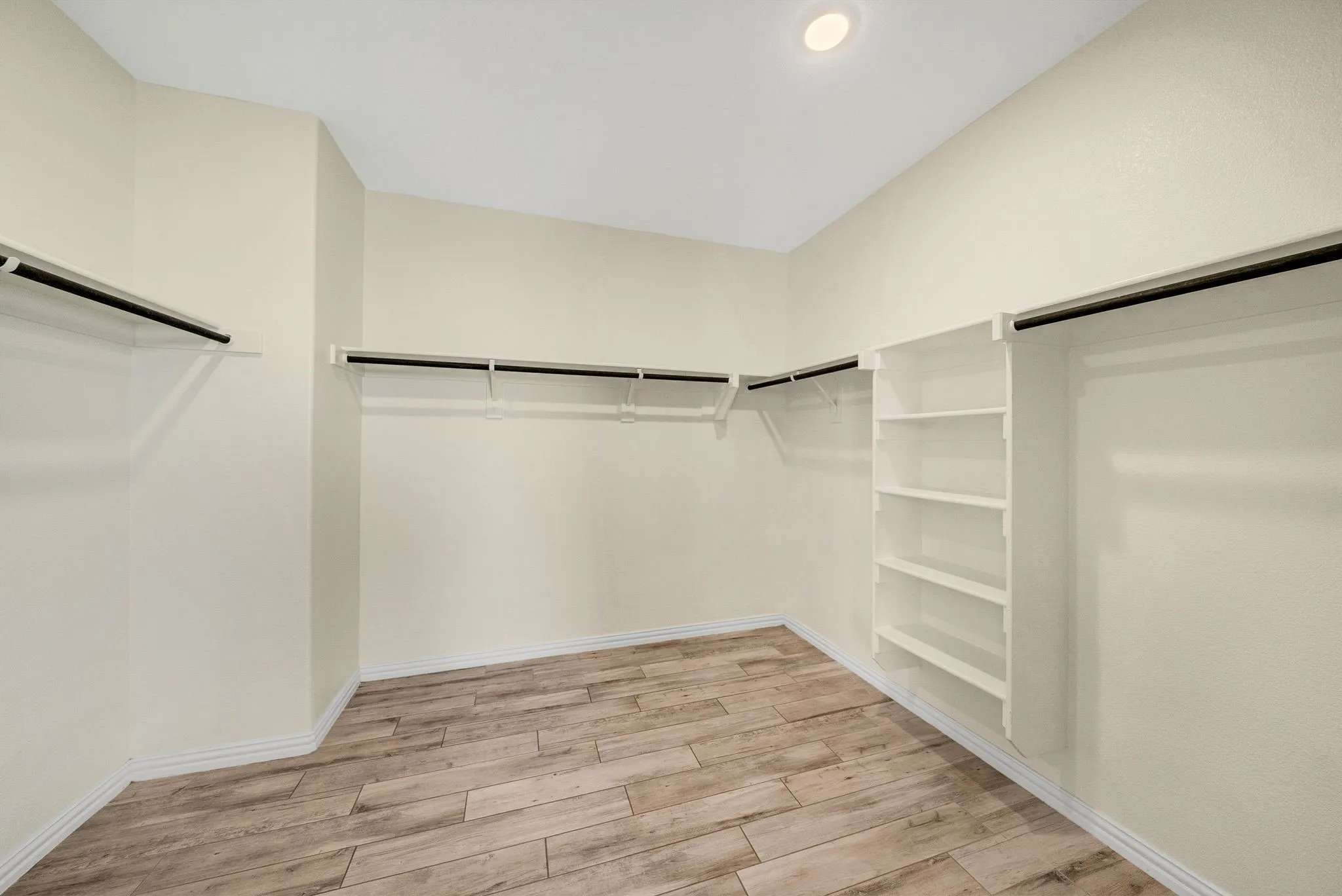 Large primary closet with ceramic tile