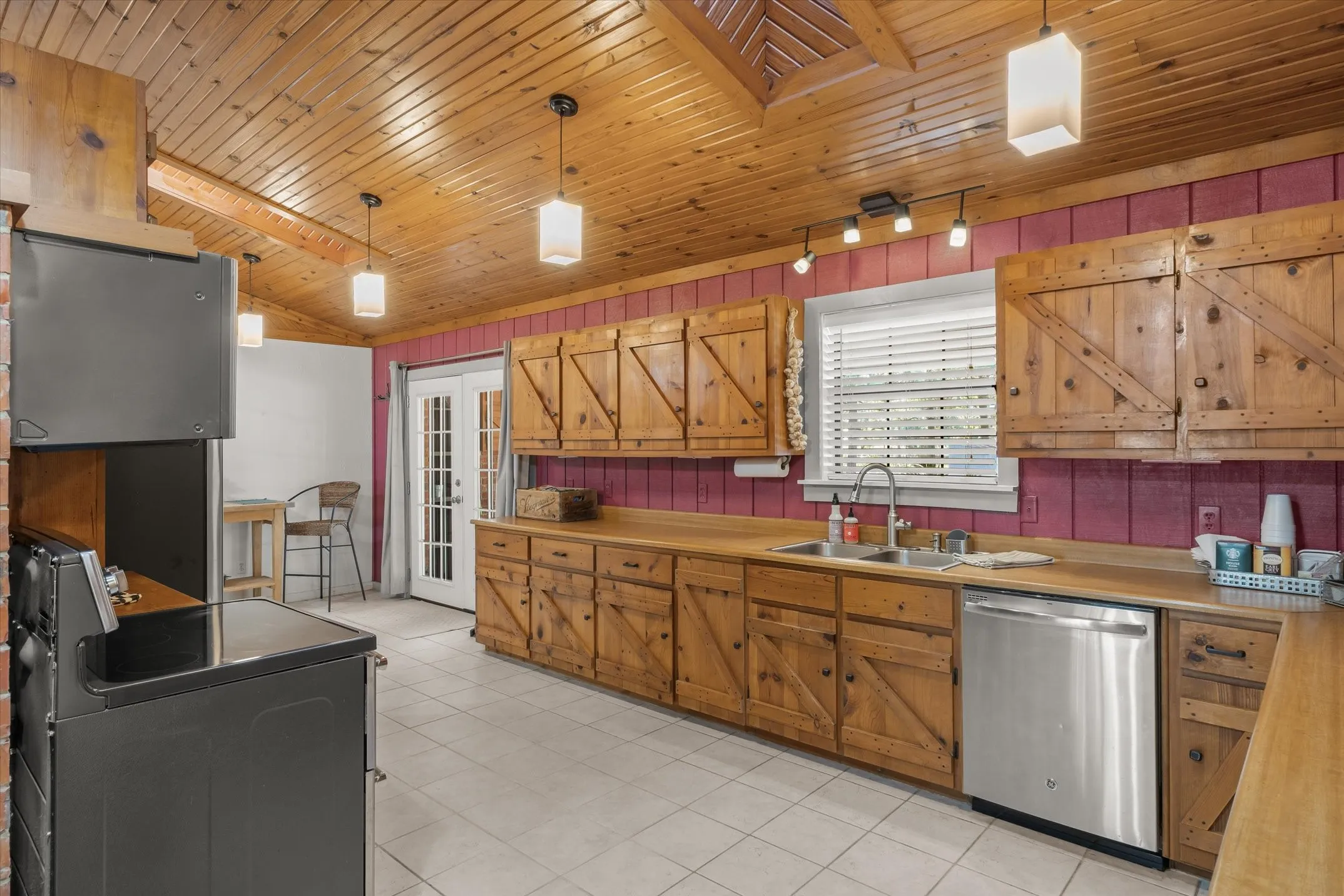 Kitchen has a kitchen sink window with views of the backyard.