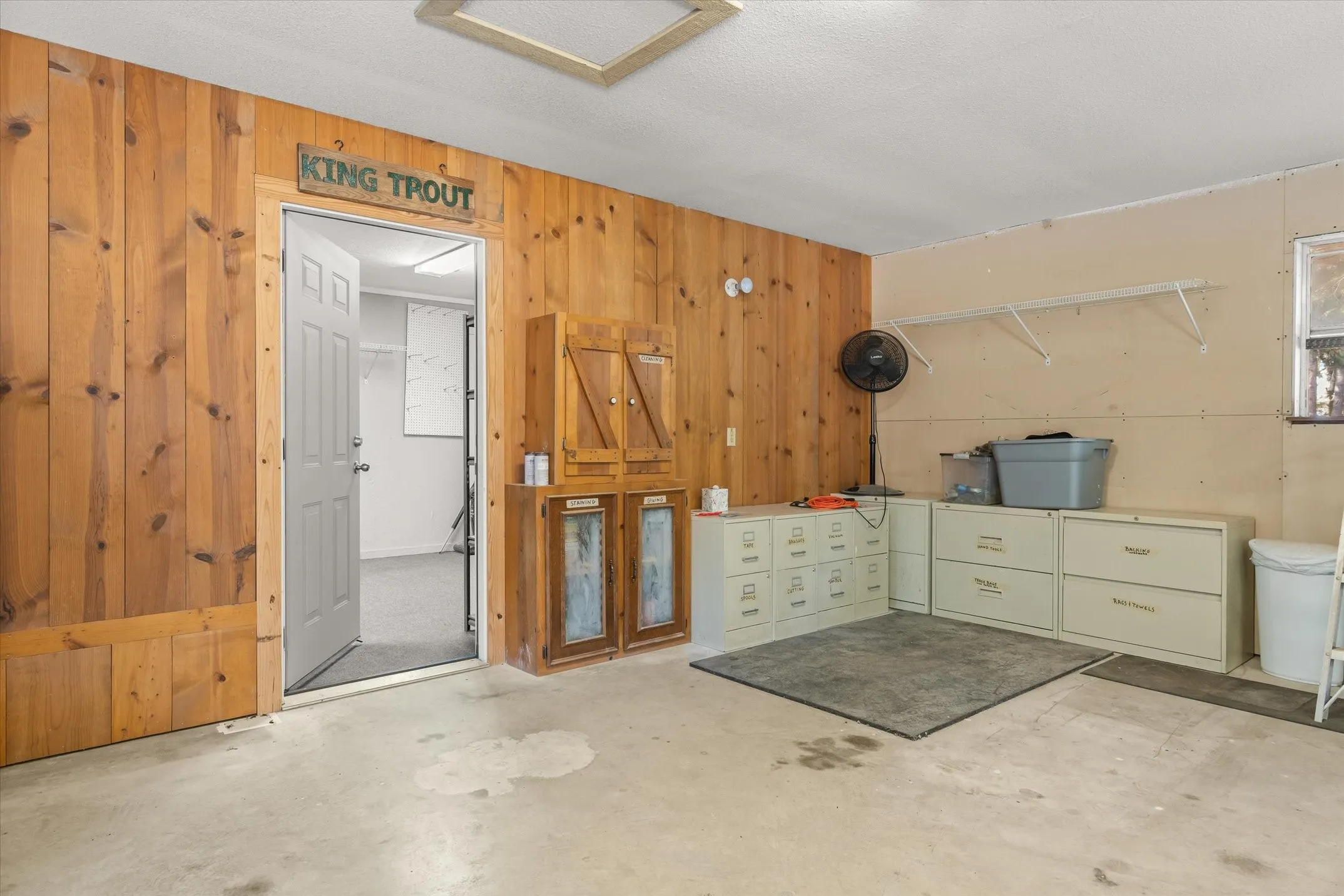 From garage/shop going into the extra workroom, man cave, office