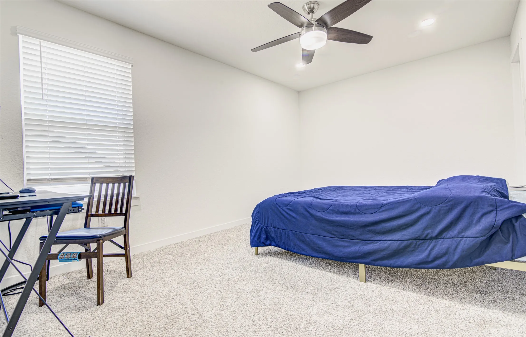 Recessed lighting, ceiling fan with light, and textured wall finish
