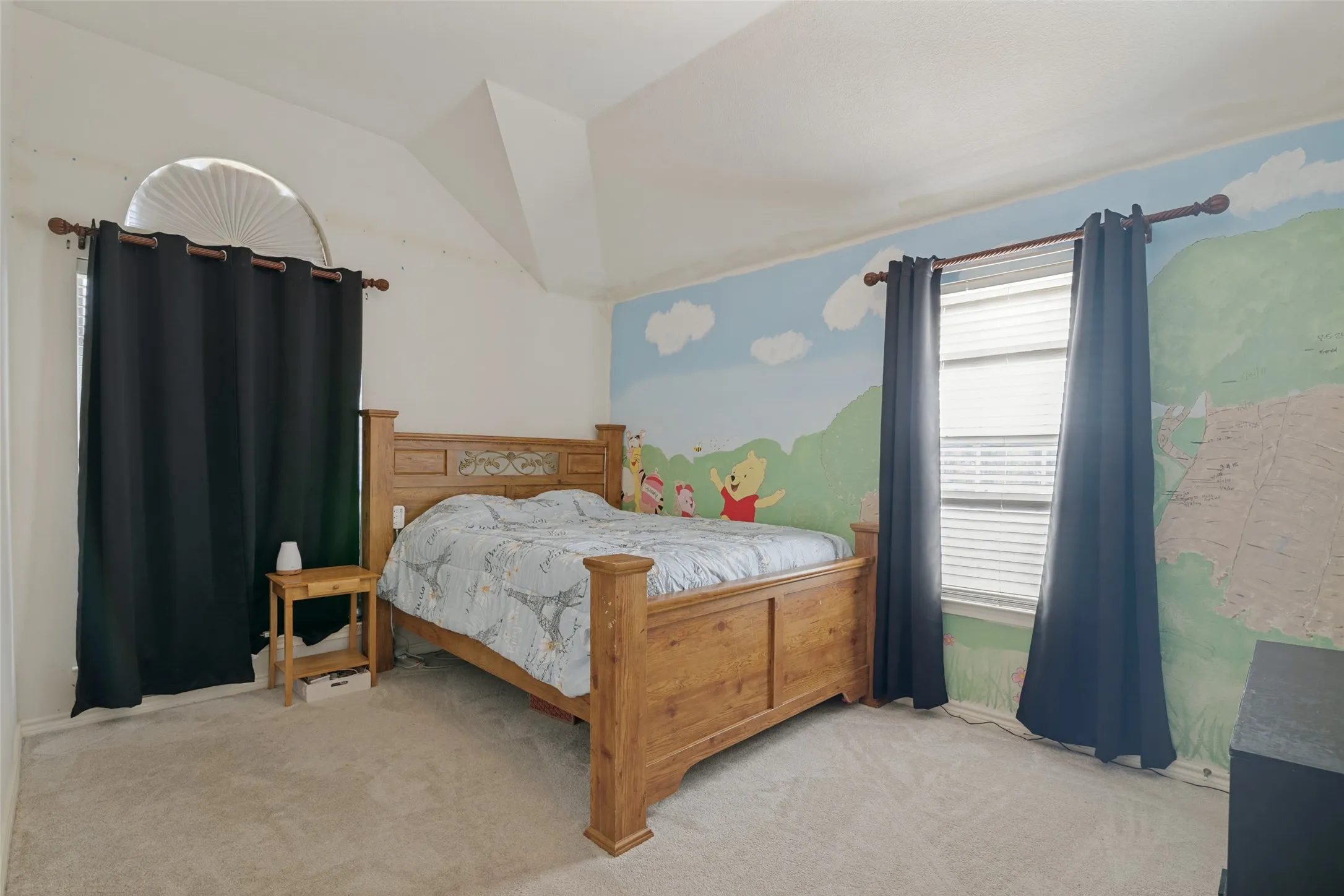 Vaulted ceiling with an arched window and a rectangular window