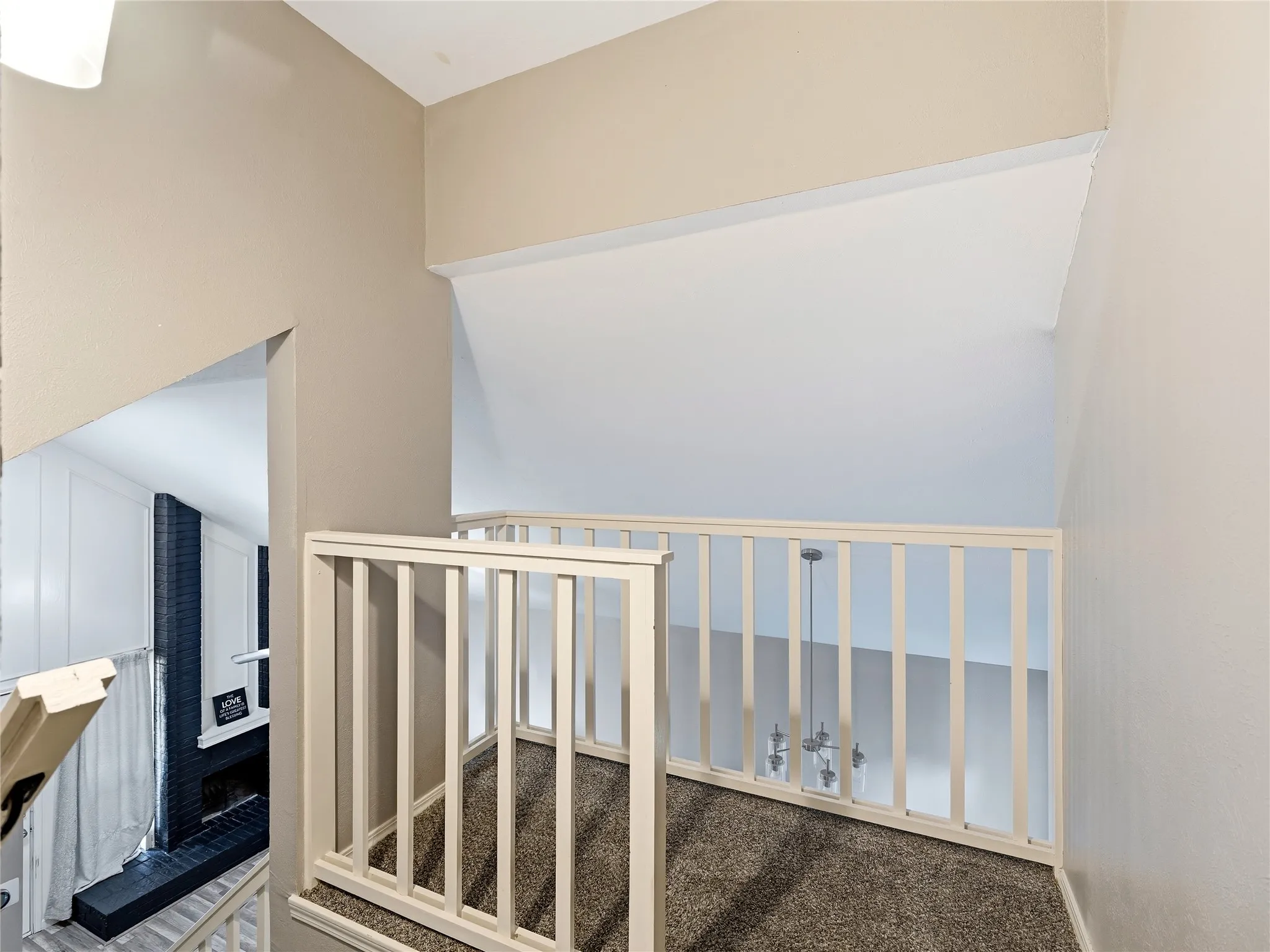 Open loft area with carpeted flooring