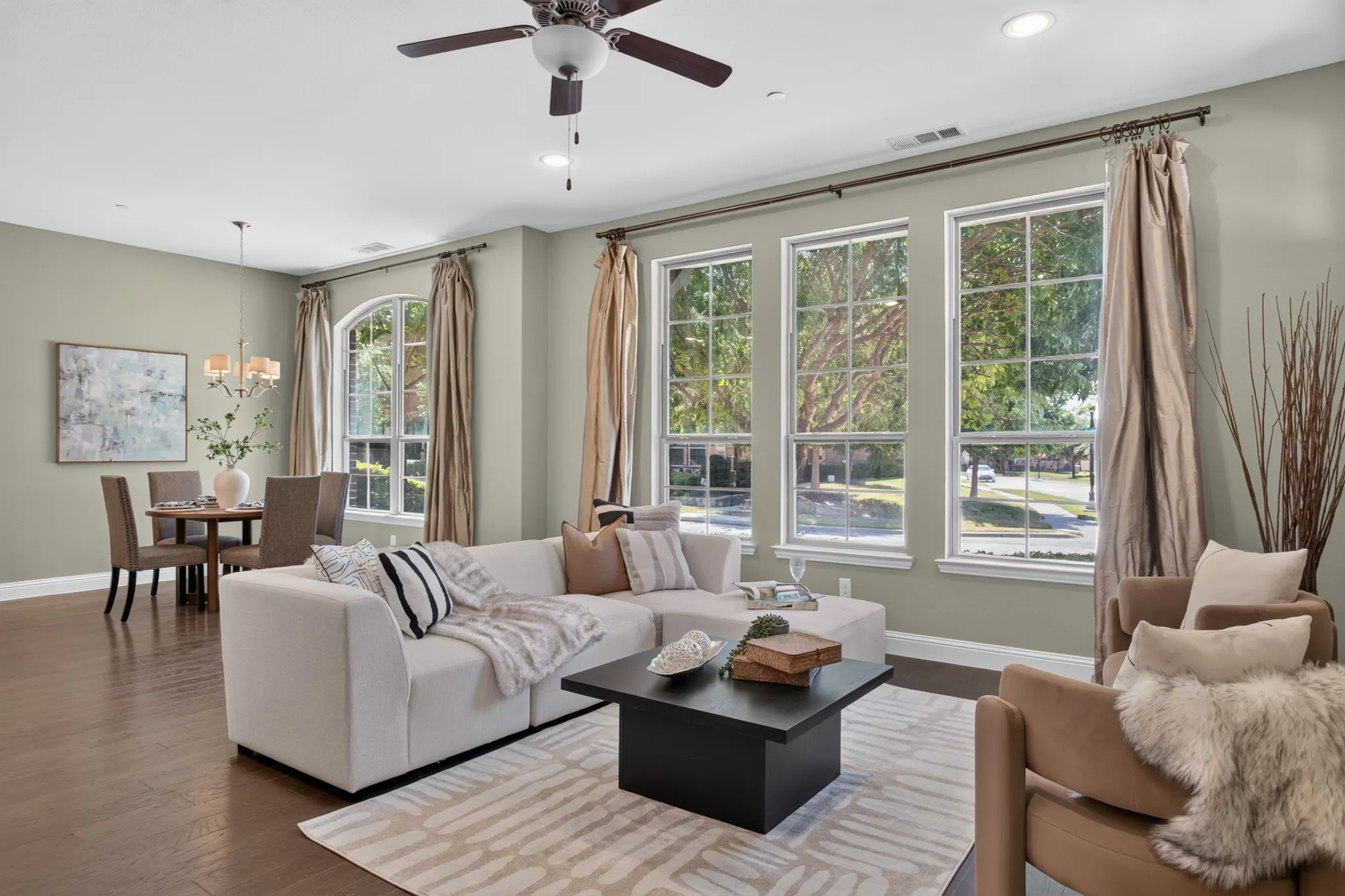 Light and bright.  Sleek Townhome living.  Corner lot- tree covered entry.
