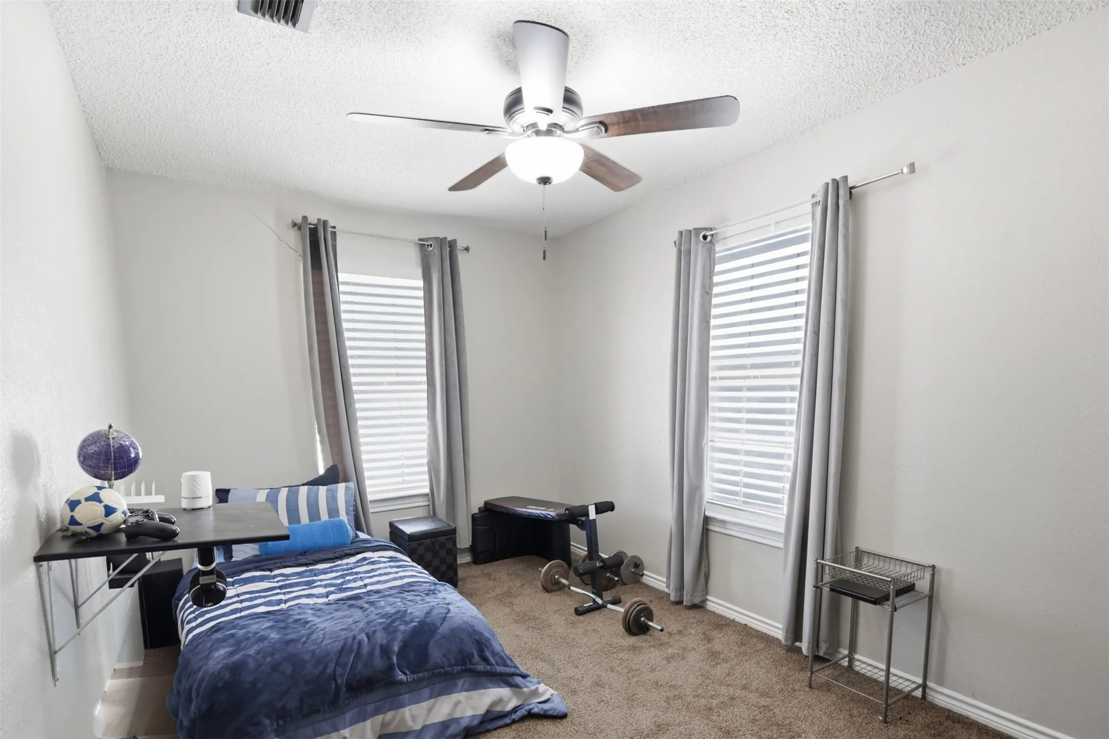 Ceiling fan with wood-finish blades and integrated lighting