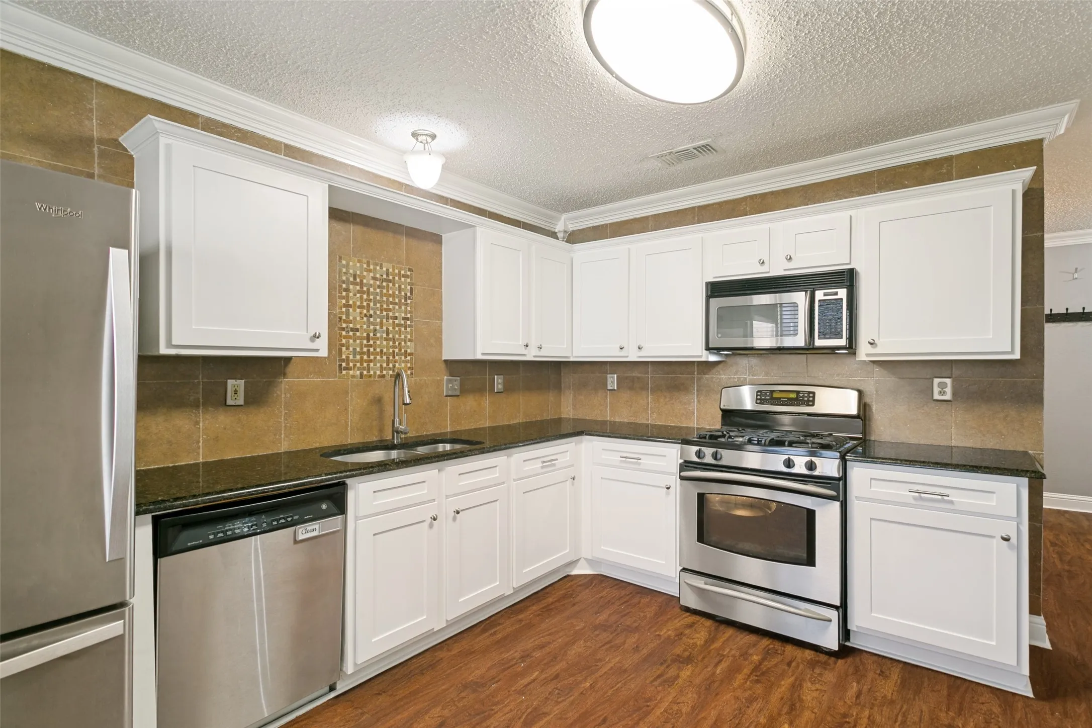 Kitchen cabinets refaced and painted in July 2026