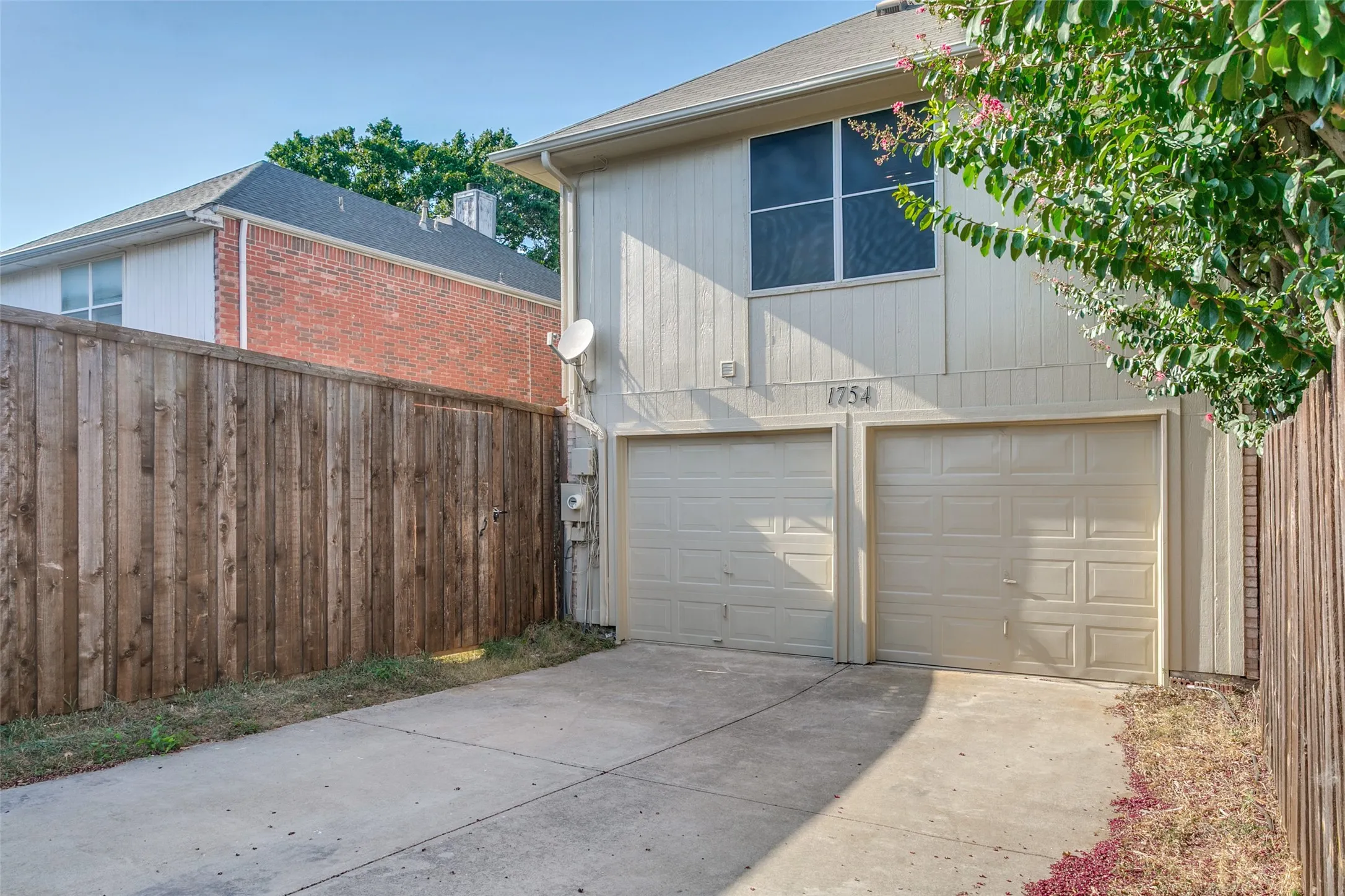Double door garage with large driveway