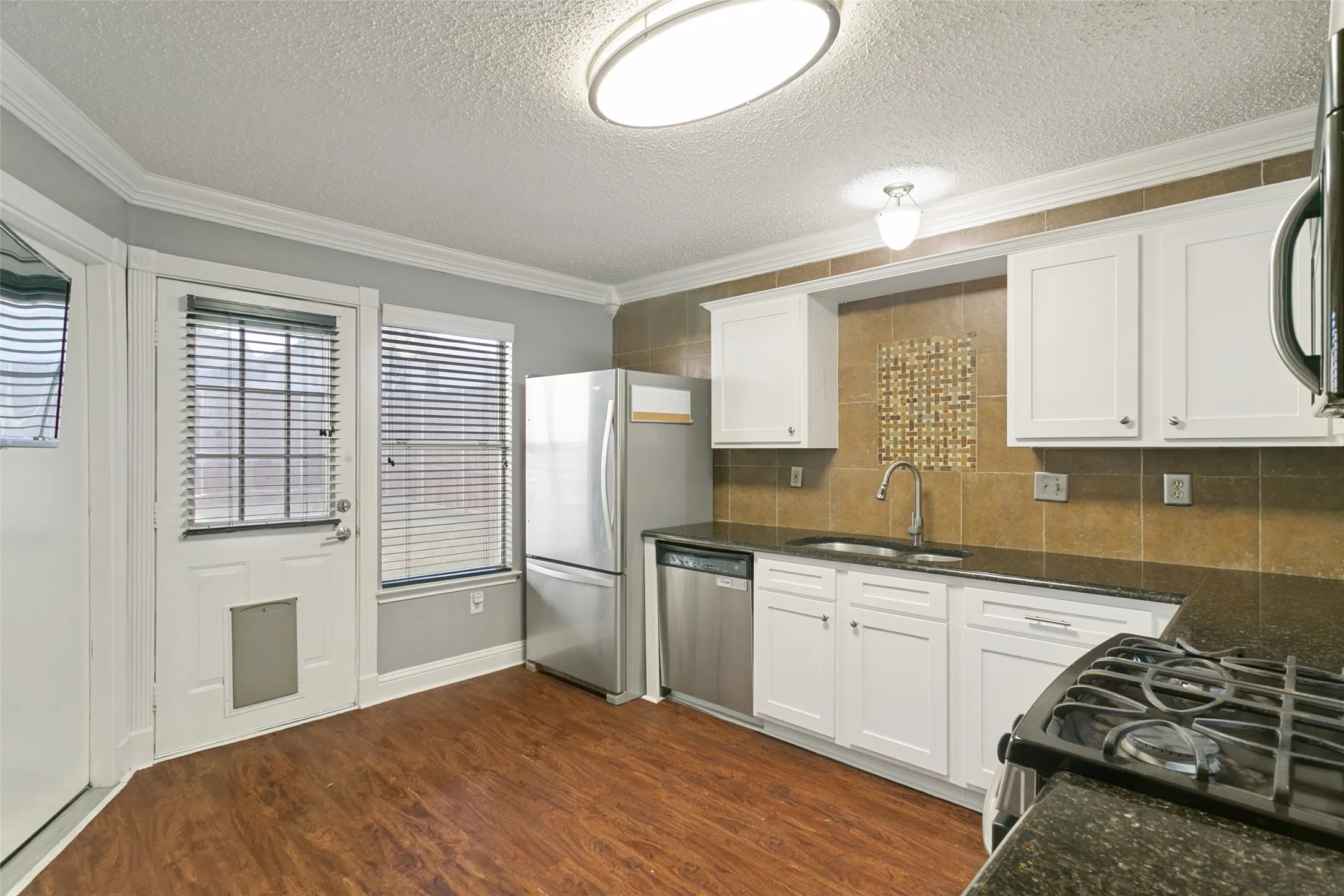 Kitchen cabinets refaced and painted in July 2026