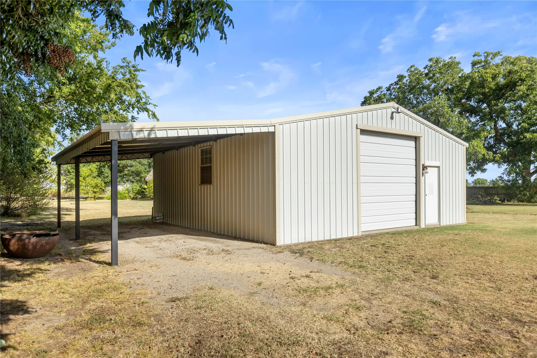 900 SF shop offering tremendous flexibility for projects and storage. Plus additional covered parking.