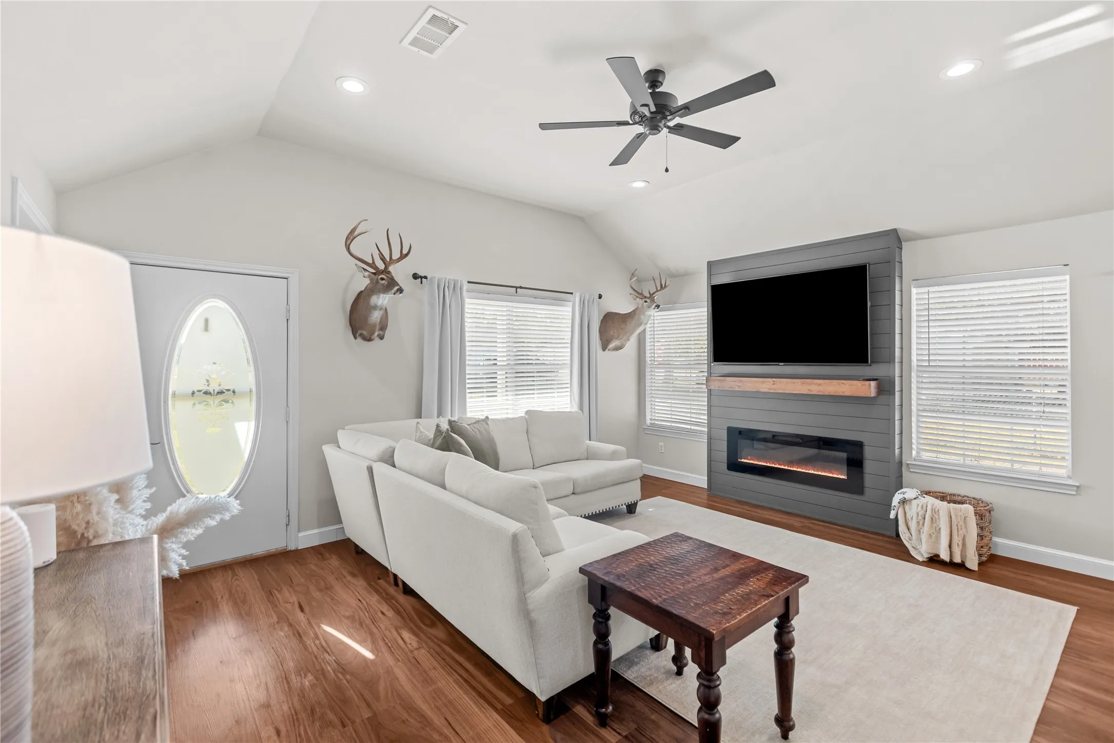 Charming living room with an electric fireplace creating a warm and inviting ambiance.