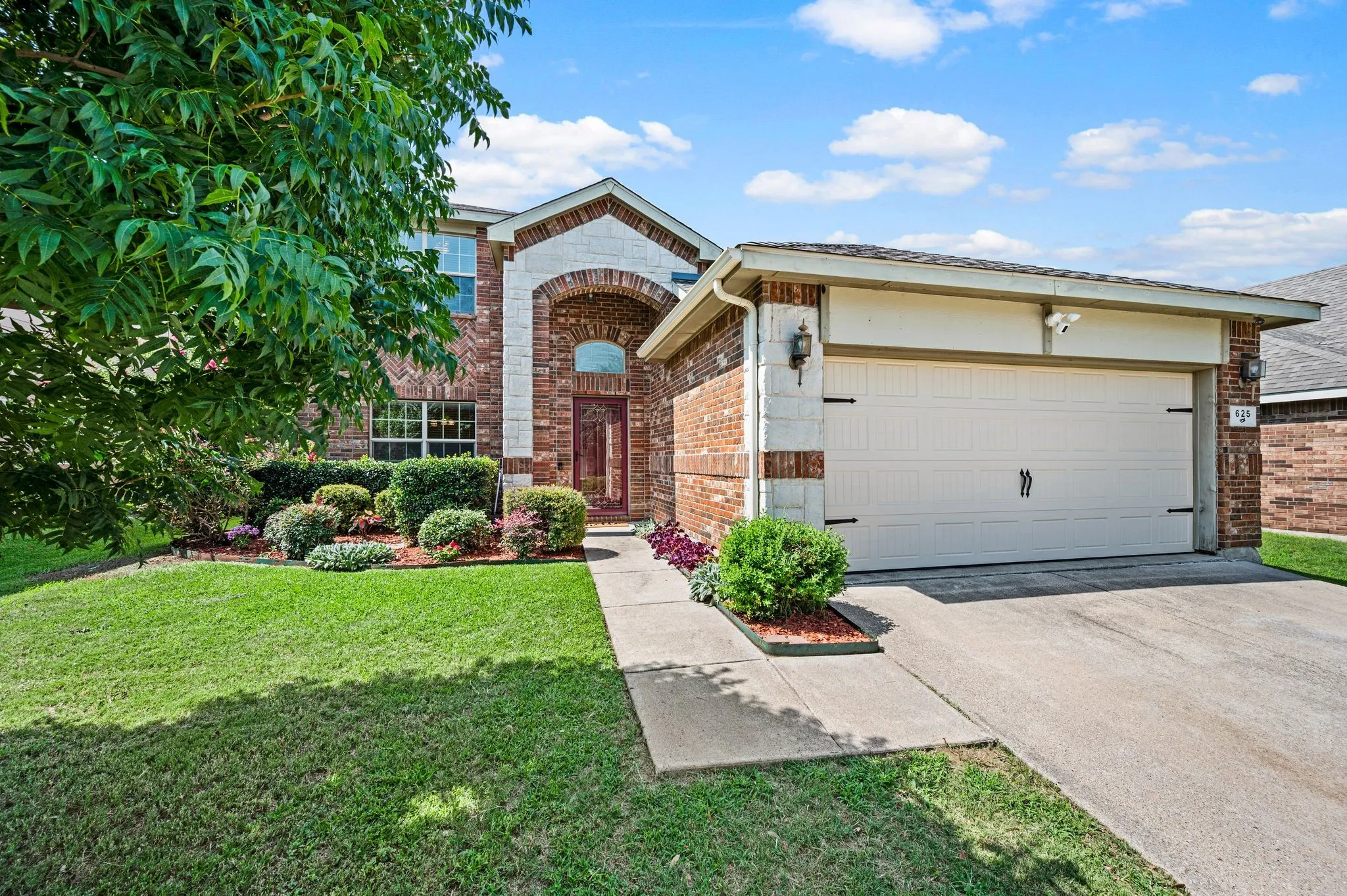Brick and stone exterior with arched entry